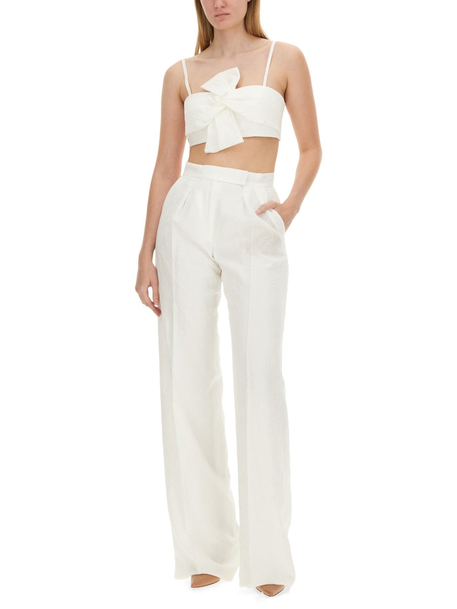 White acetate sleeveless crop top by Max Mara, close-up of sweetheart neckline