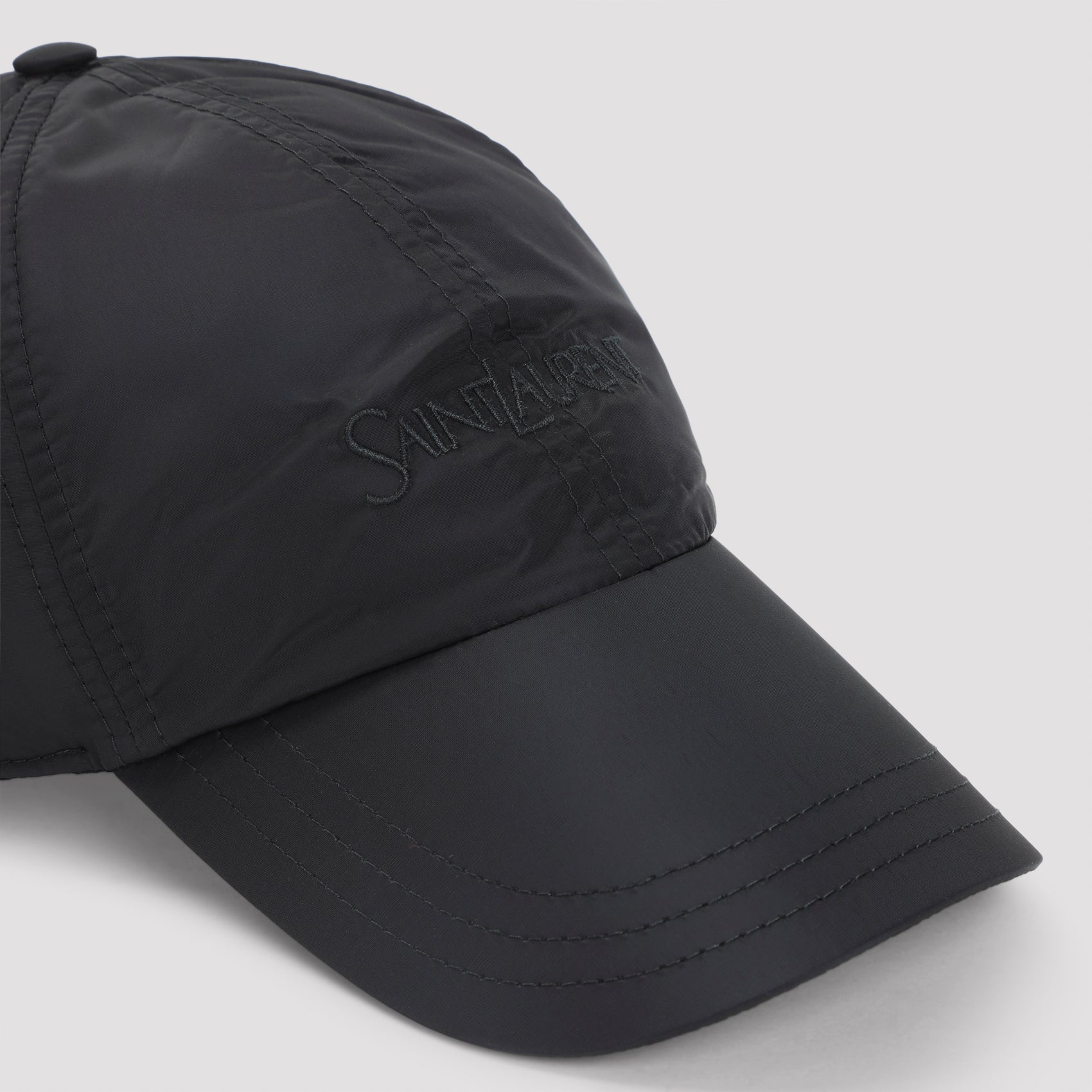 Black Saint Laurent baseball cap showing paneled construction detail