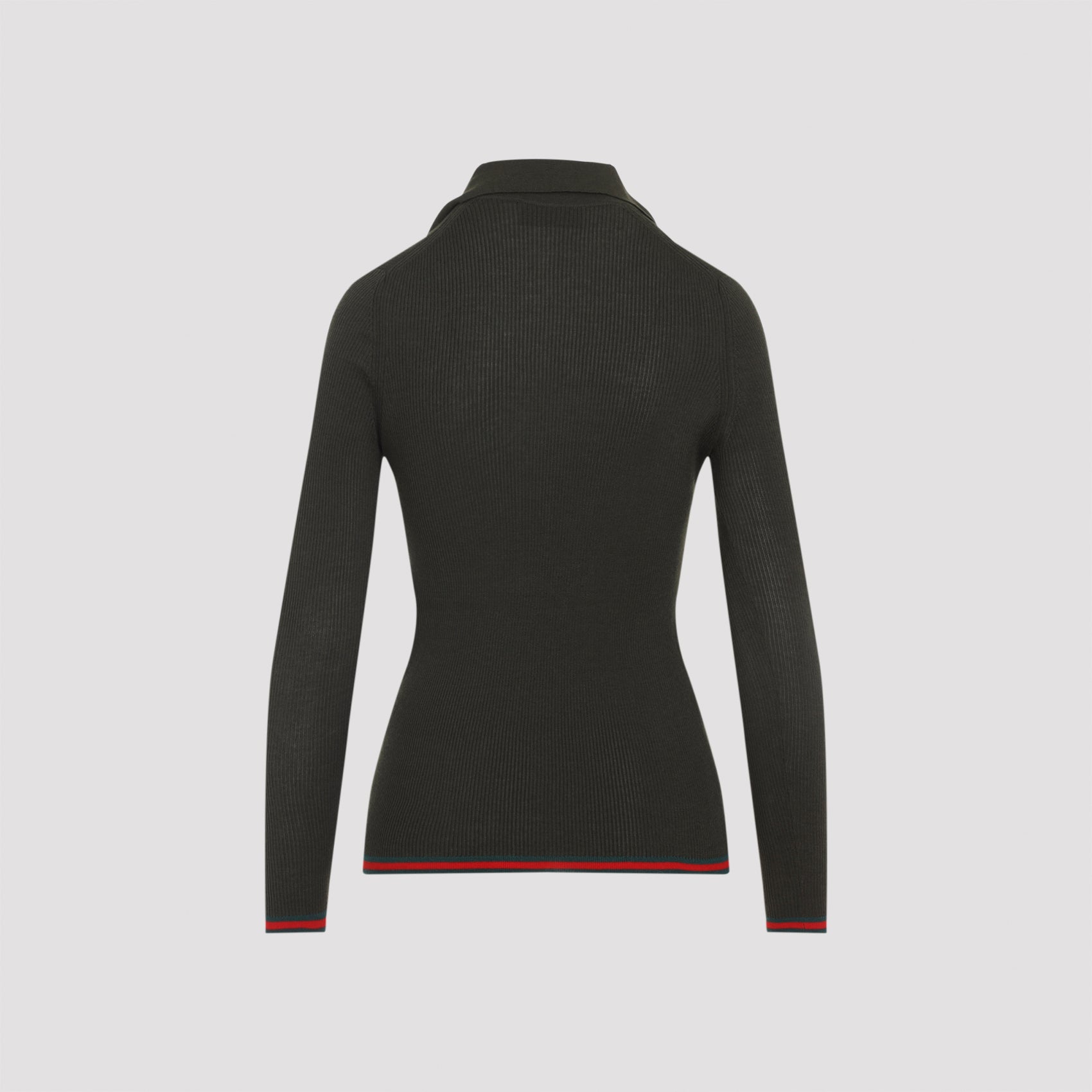 Gucci polo collar detail with logo jacquard placket, close-up