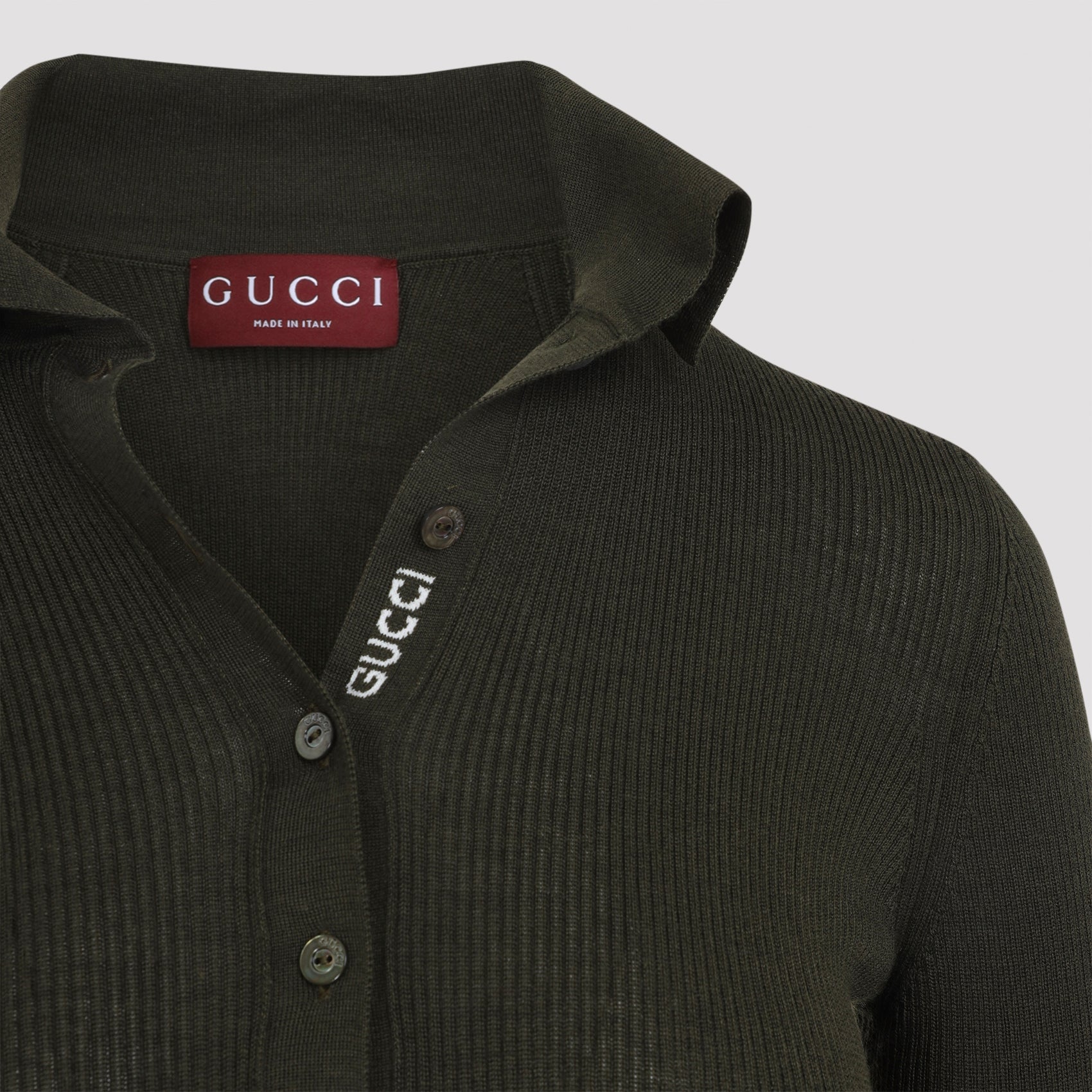 Gucci polo cuff detail with red and green Web stripe, close-up