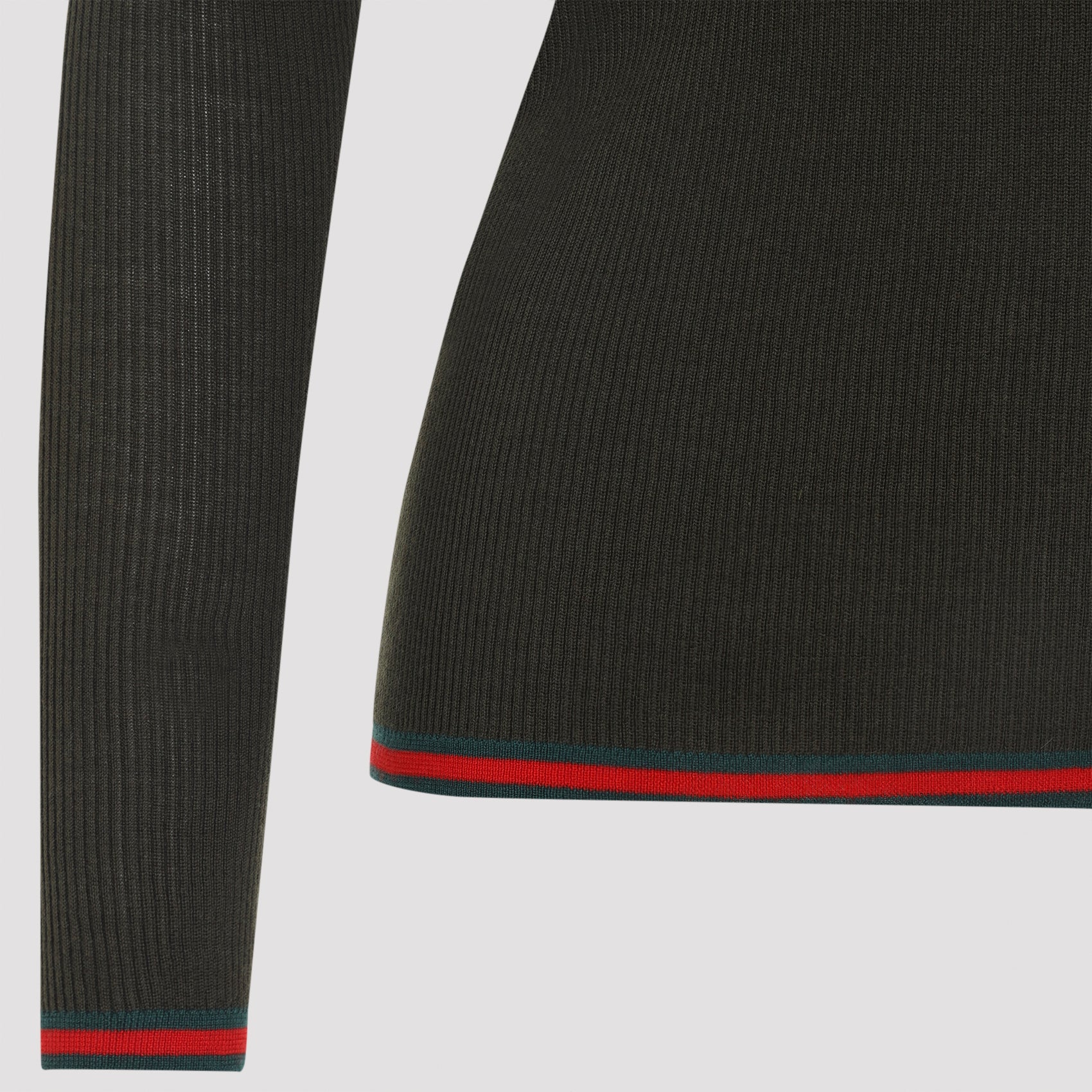 Gucci polo hem detail with red and green Web stripe, close-up