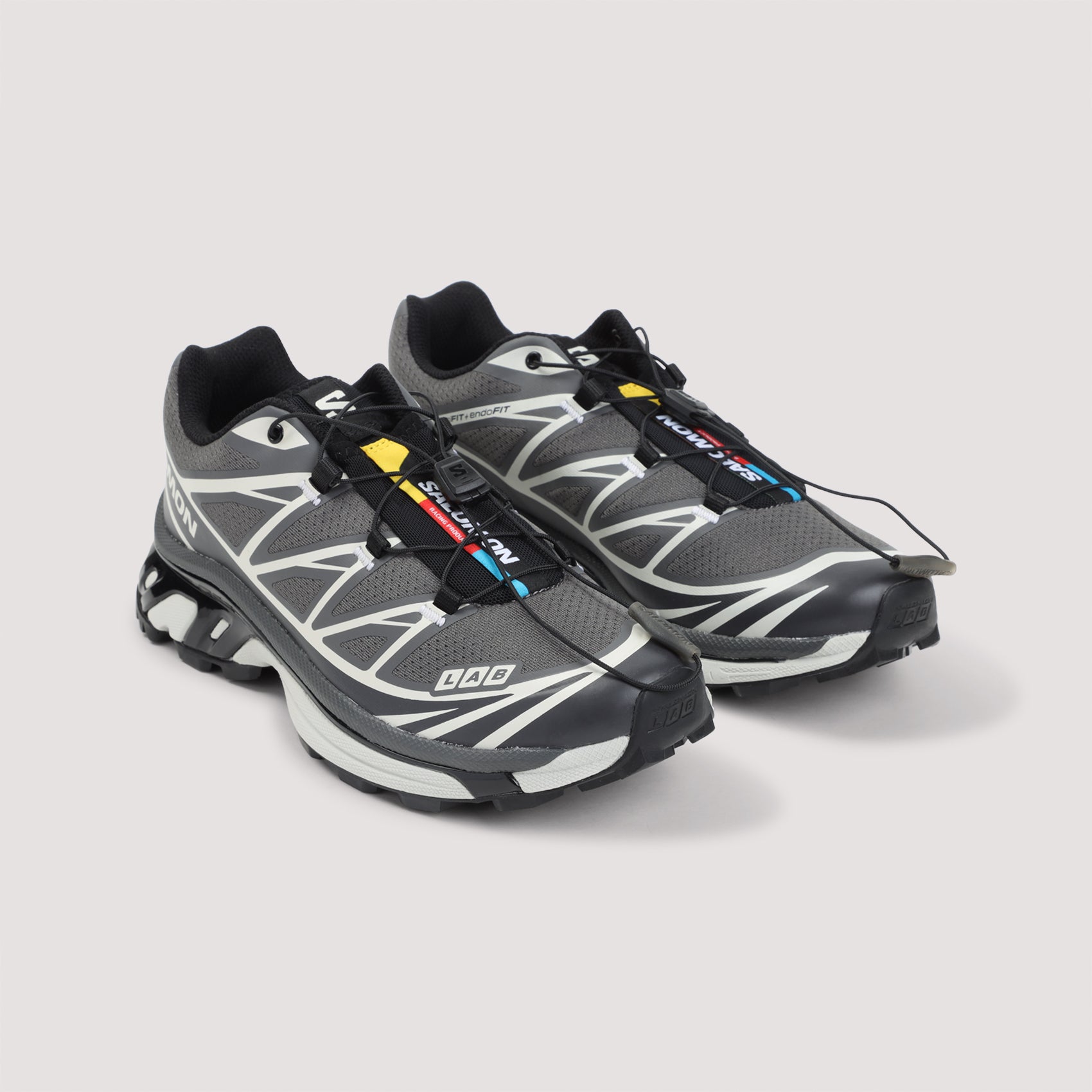 Salomon XT-6 grey mesh sneakers with multicolor tongue label, detail view