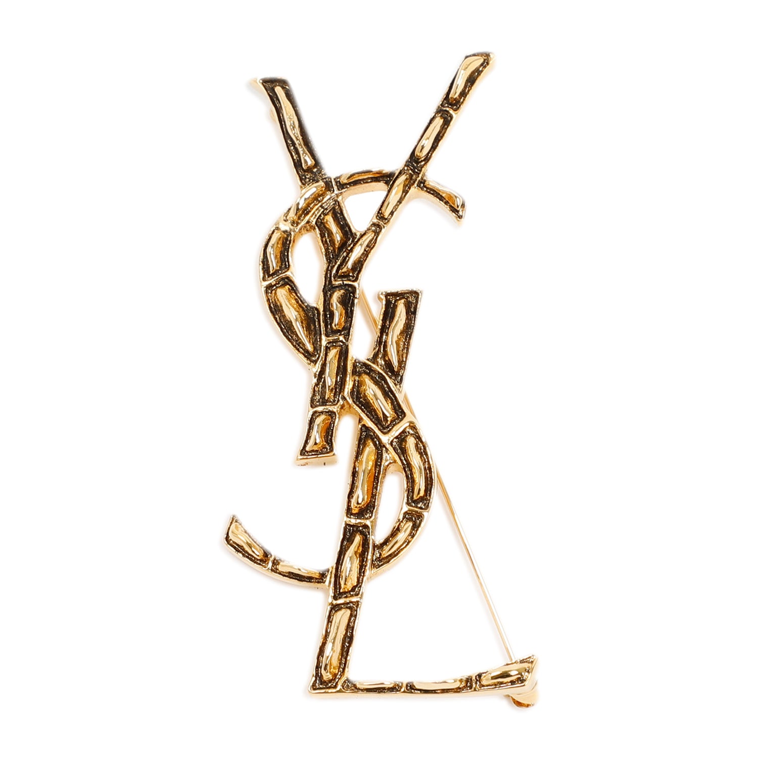 Saint Laurent brass brooch showing textured Coco print detail
