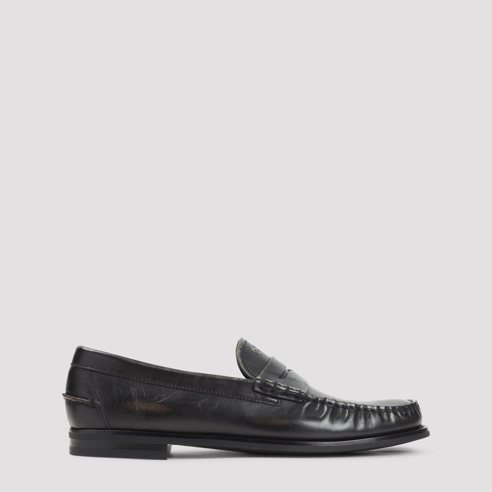 Black aged-effect leather loafer by Prada, side view