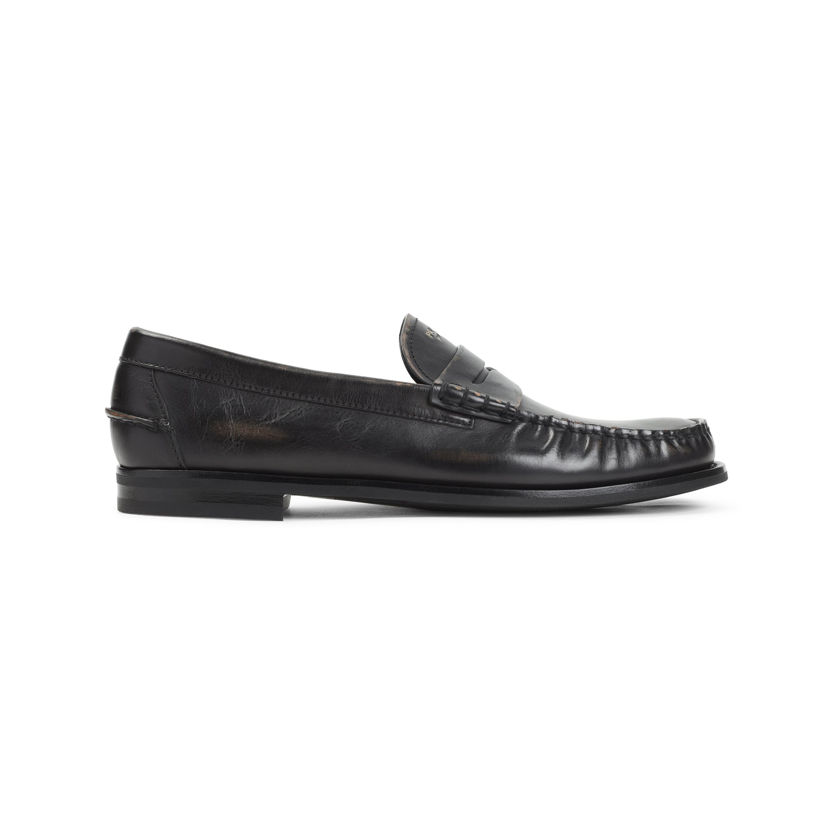 Black Prada loafer with stitched apron toe, front angle