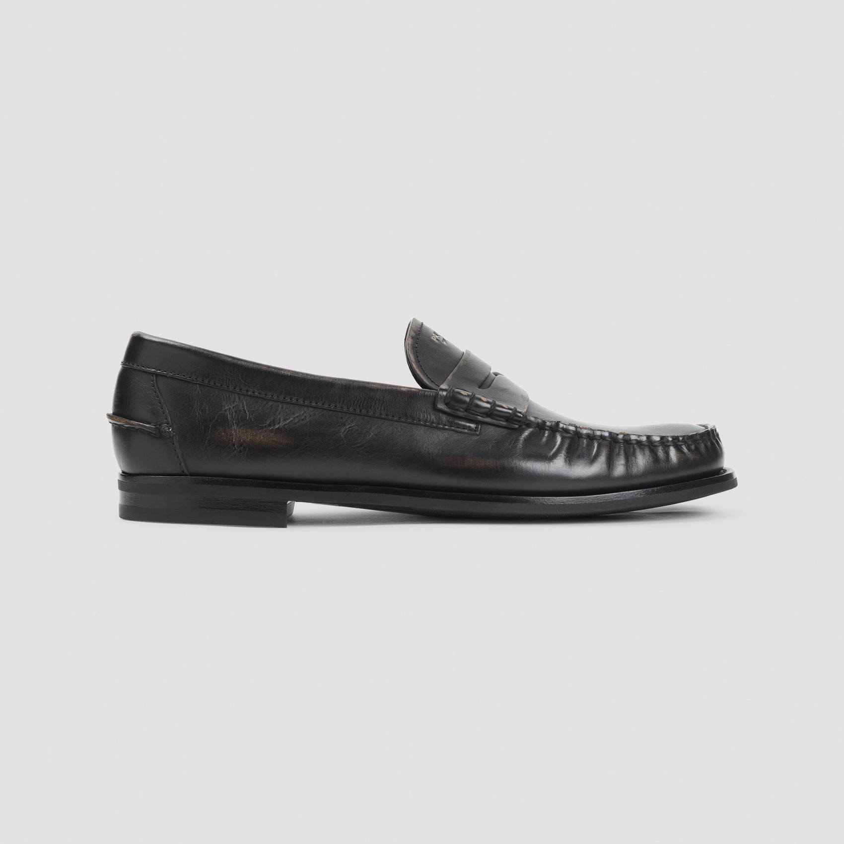 Prada leather loafer showing antiqued strap detail, top view