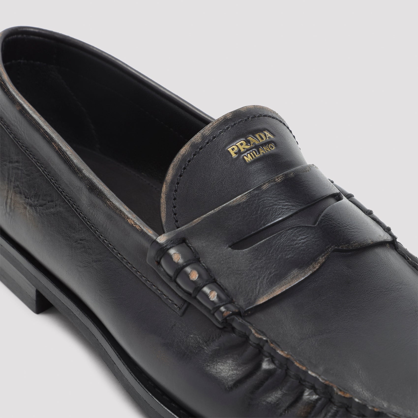 Black aged-effect leather loafer by Prada, interior view