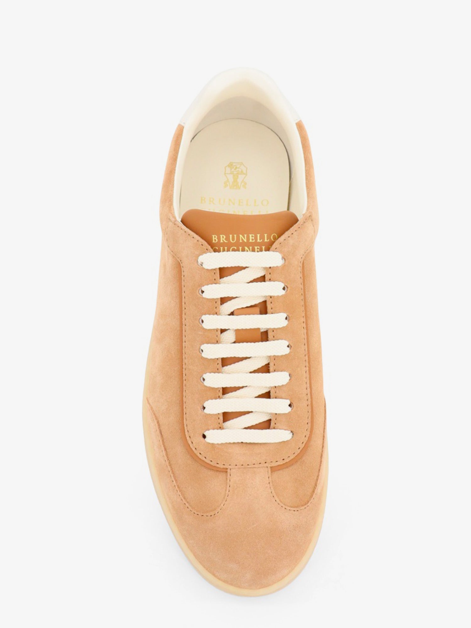 Beige low-top sneakers by Brunello Cucinelli with rubber sole, bottom view