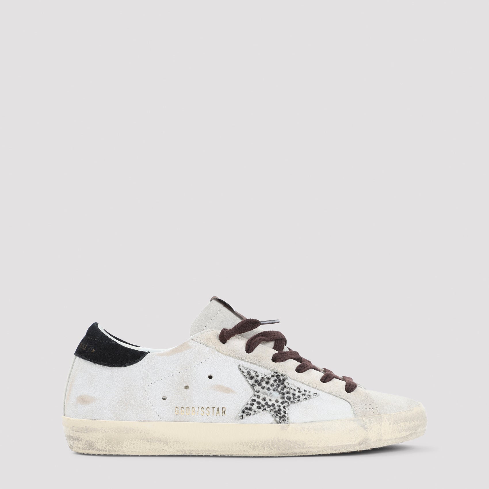 White Golden Goose Superstar sneakers with leopard-print star, lateral view