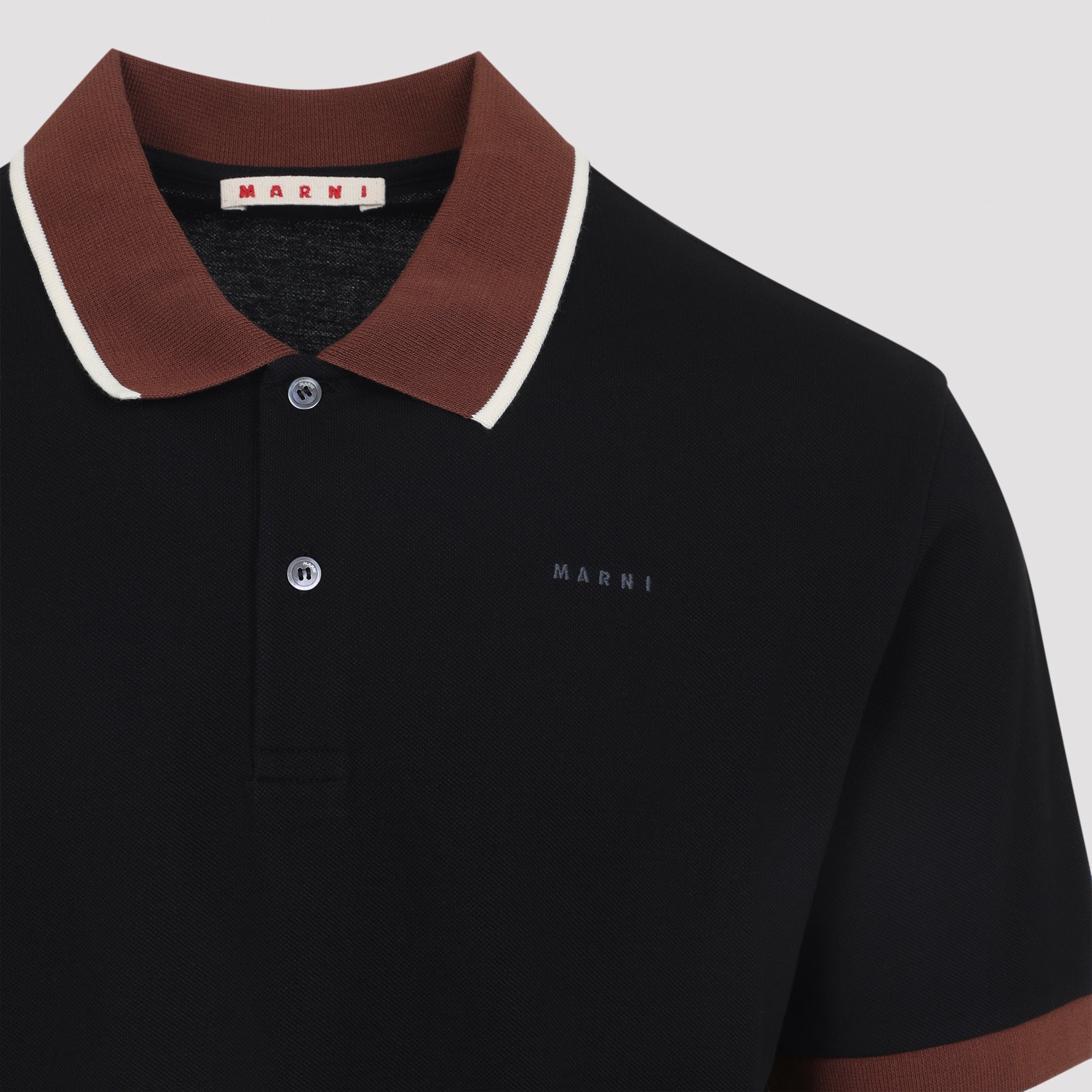 Black Marni polo with tobacco-brown ribbed cuffs, sleeve detail
