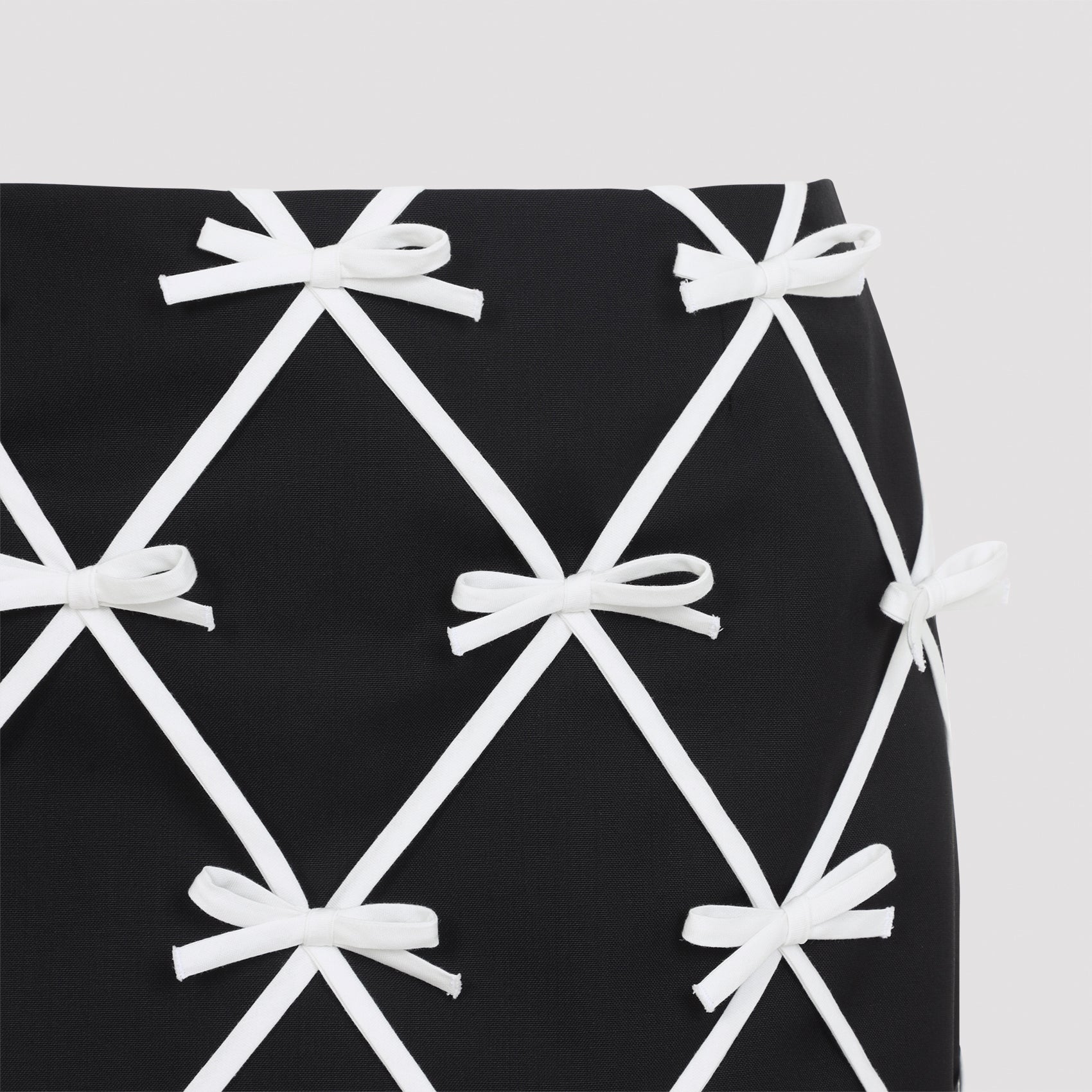 Black Moschino virgin wool mini skirt with ribbon lattice motif, detail view