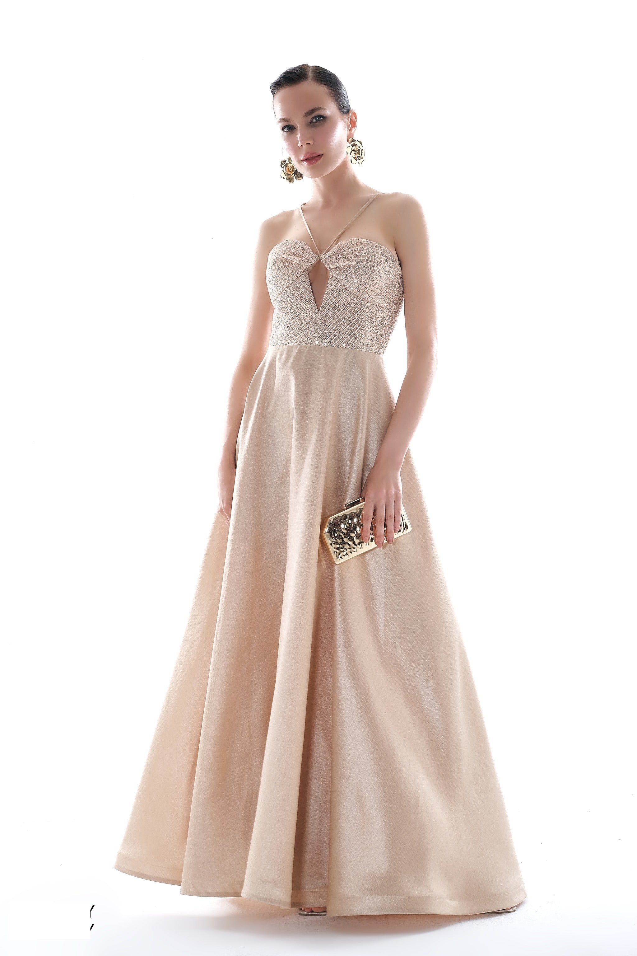 Champagne beaded ball gown with floor-length skirt, studio shot