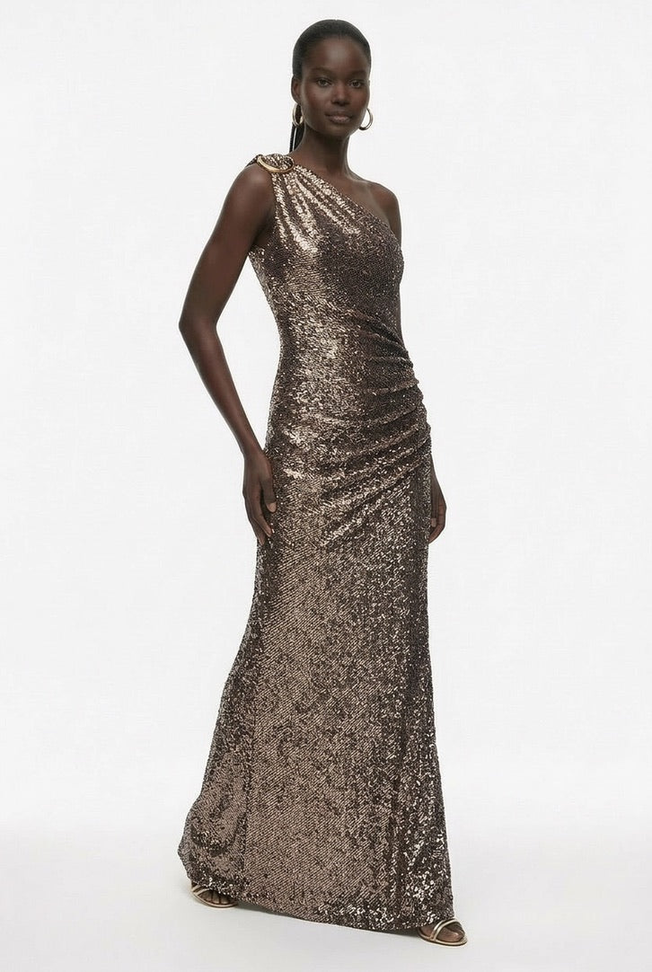 Bronze sequin one-shoulder gown showing sculptural neckline and hardware