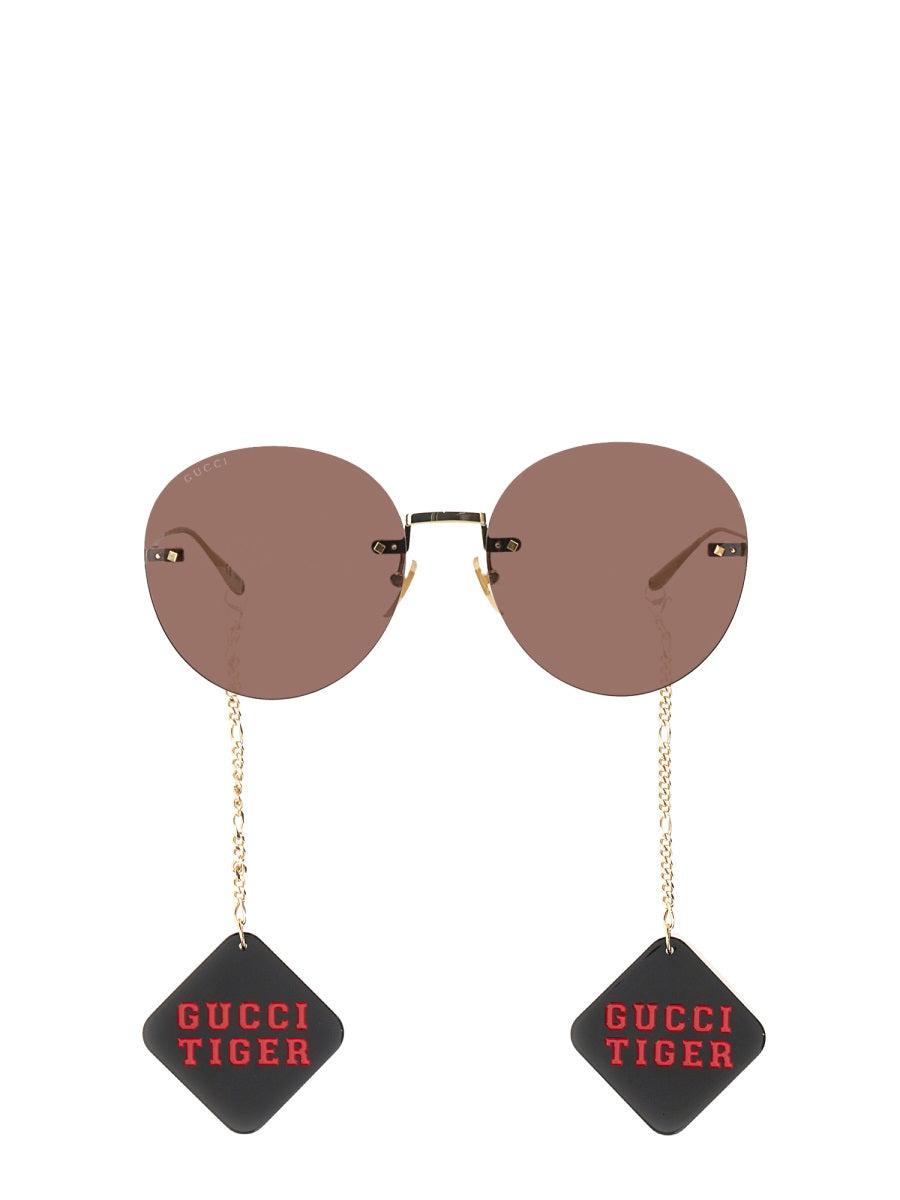 TIGER GLASSES WITH PENDANT Gucci