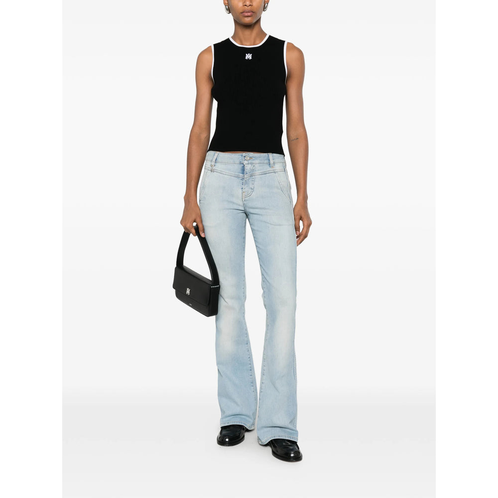 Black AMIRI sleeveless crop top, side view showing cropped hem