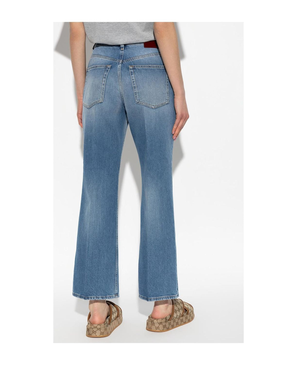 DENIM PANTS WITH LOGO LABEL Gucci