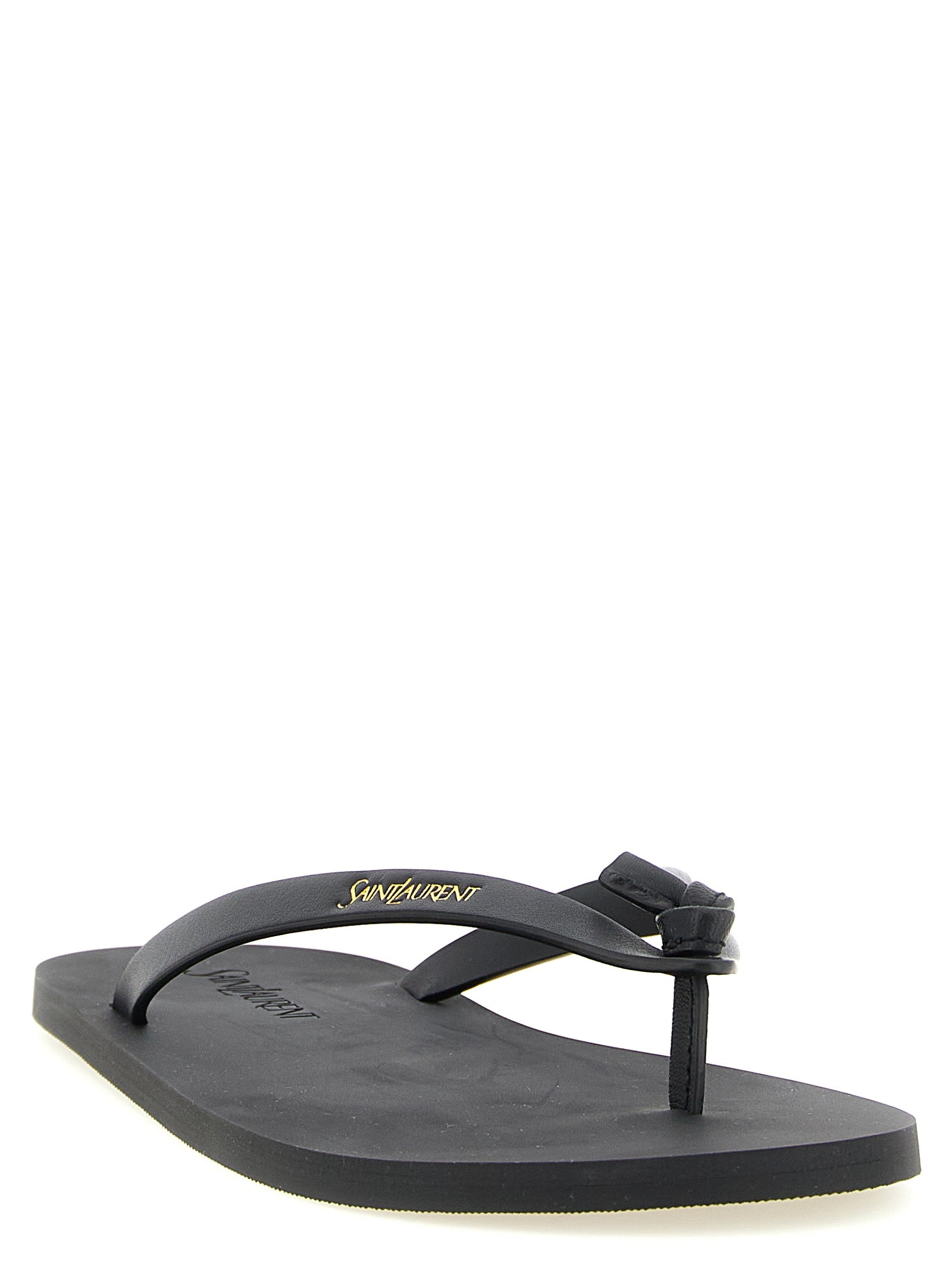 Black leather Pool flip flops by Saint Laurent, side angle view