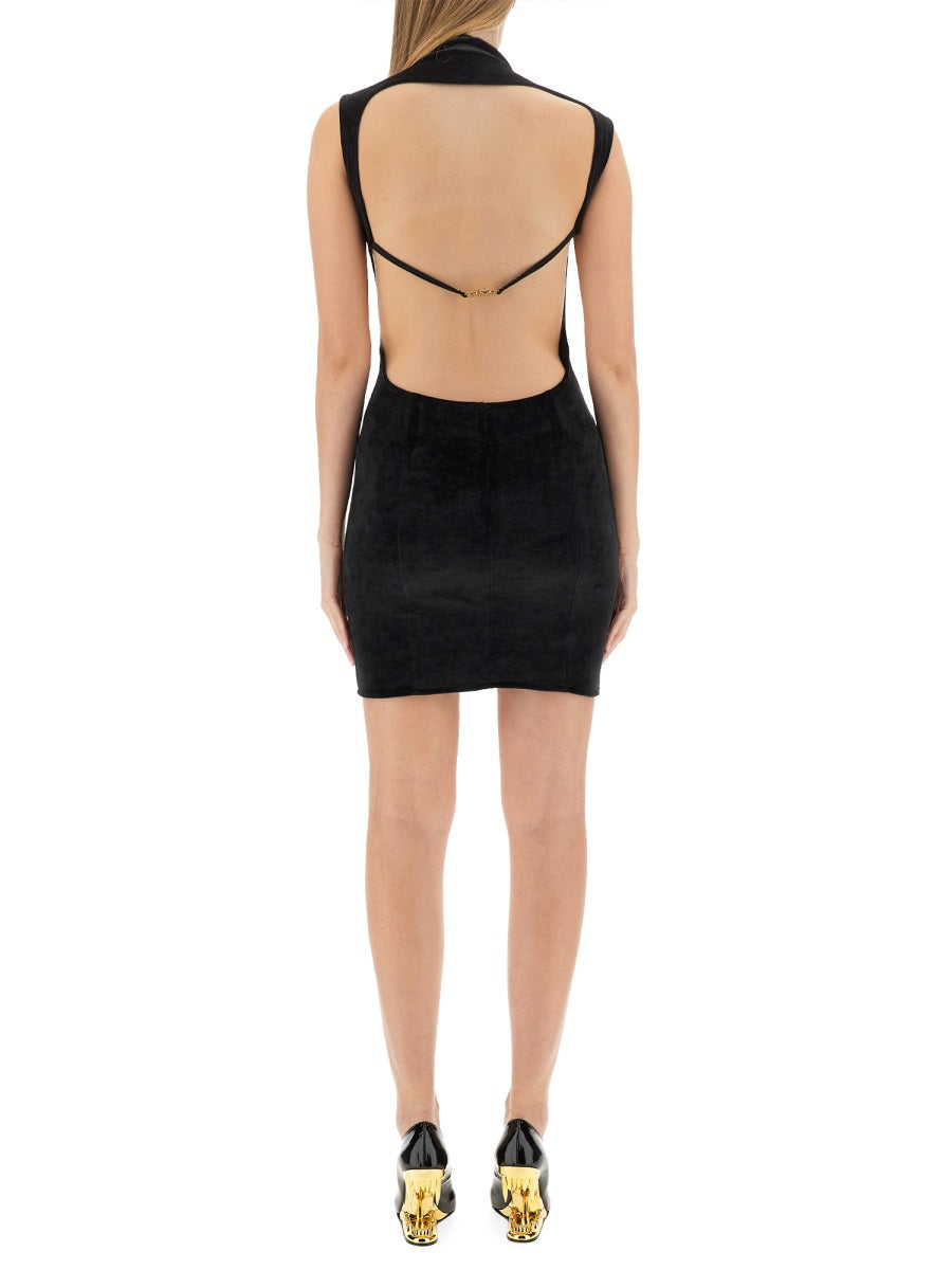 Black GCDS sleeveless mini dress on model, three-quarter view