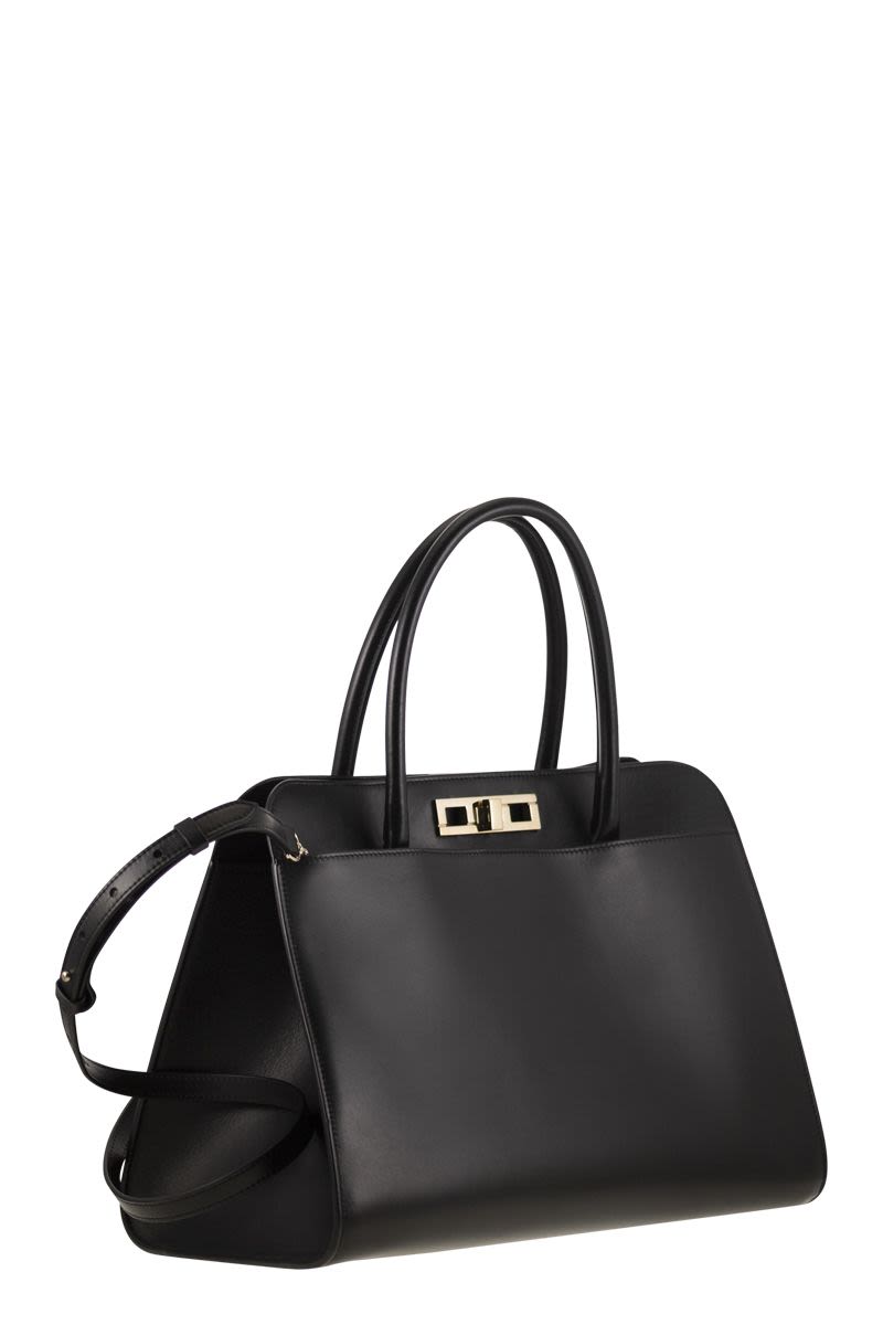 LARGE HANDBAG WITH METAL ACCESSORY Fabiana Filippi