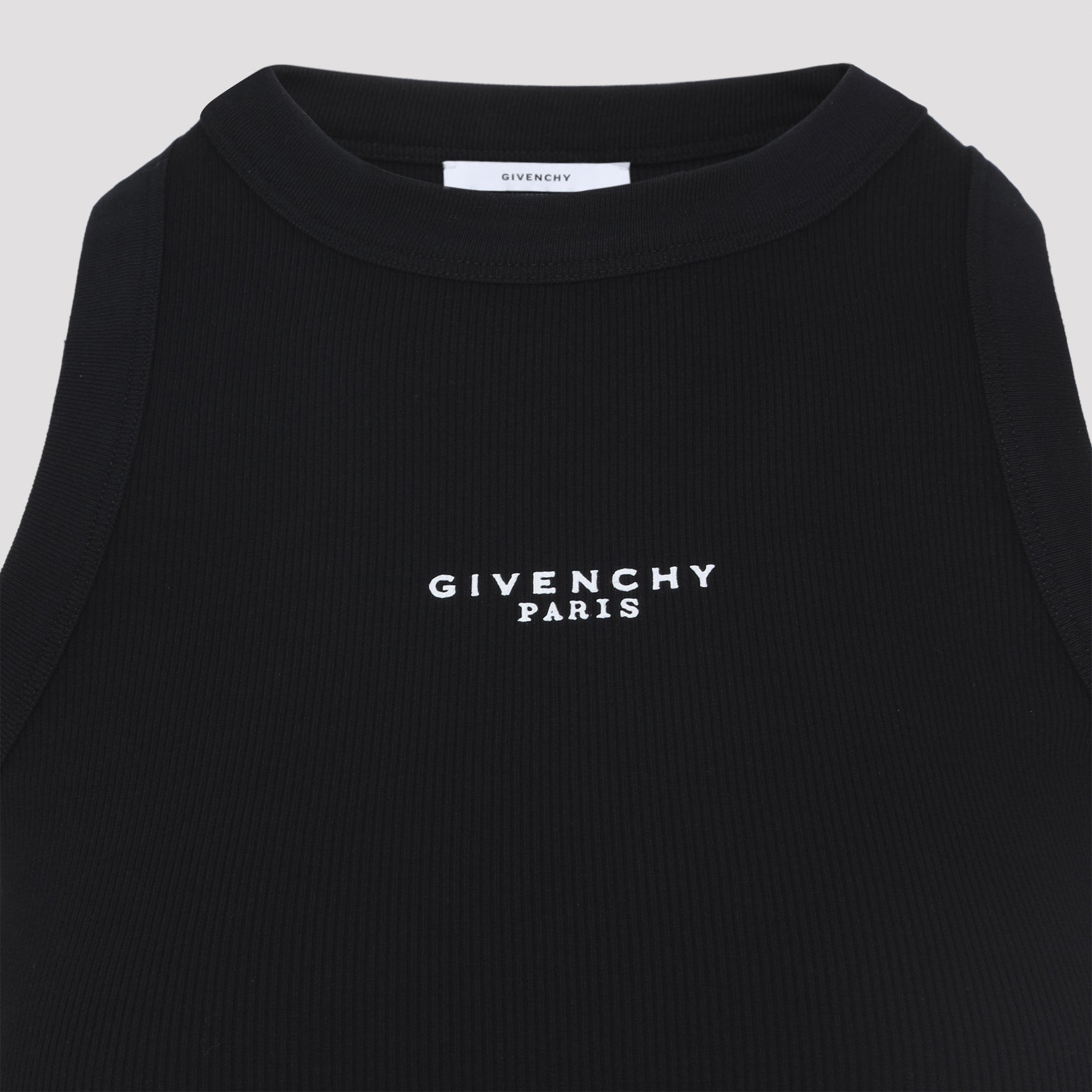 Black Givenchy crop top detail view showing logo placement by Givenchy