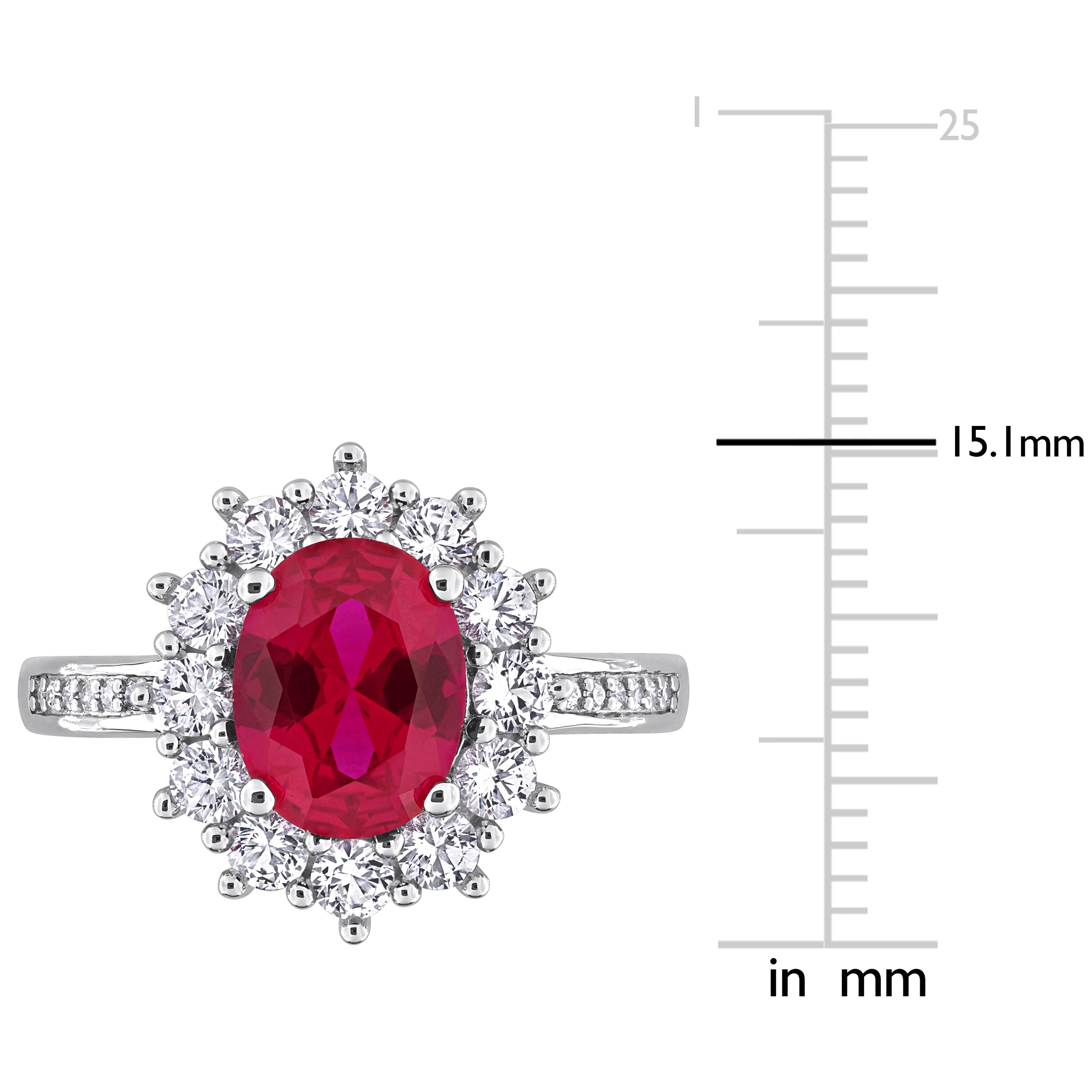 Oval created ruby center stone with white sapphire halo, close-up view by Lord & Taylor