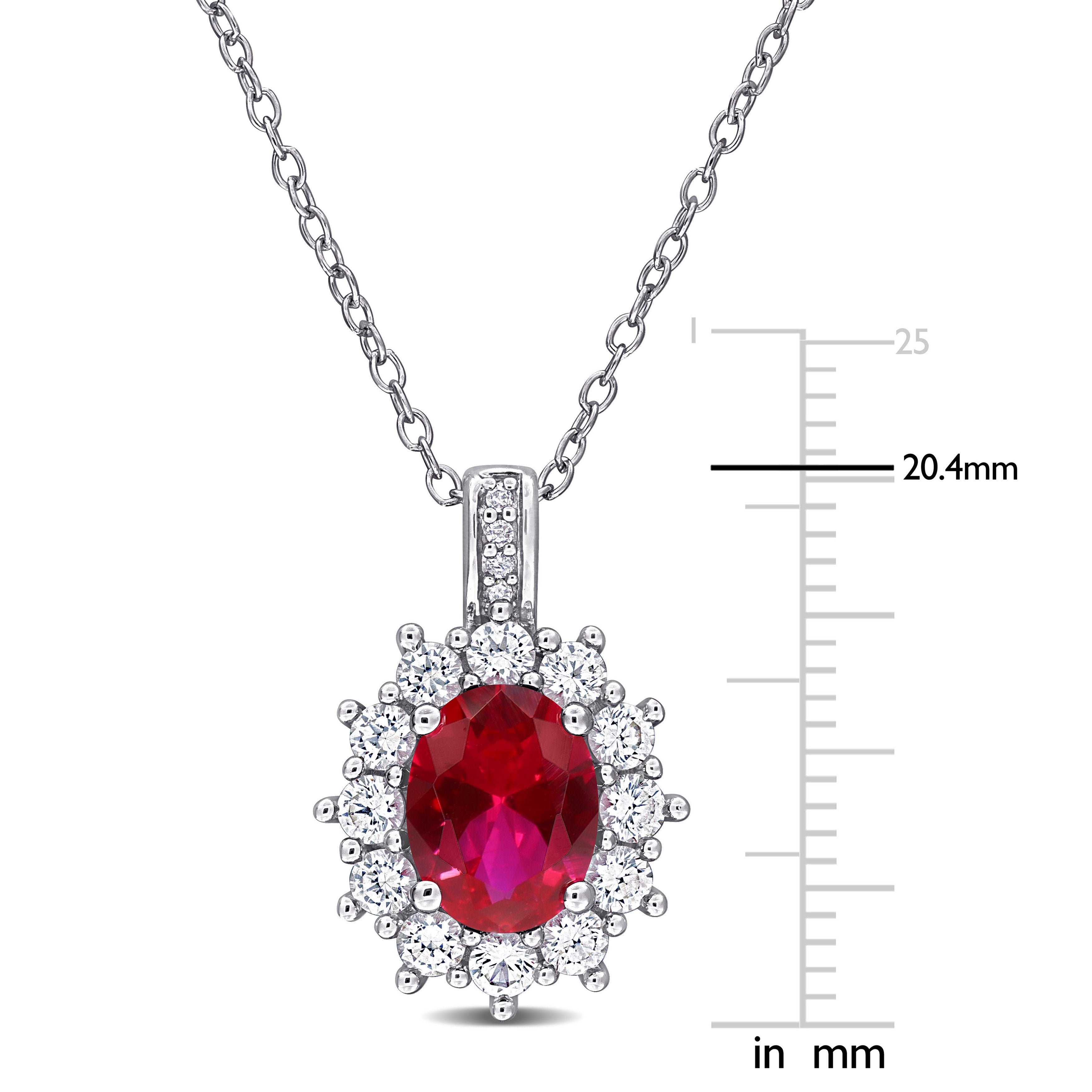 Red ruby halo pendant necklace close-up showing high polish sterling silver setting by Delmar