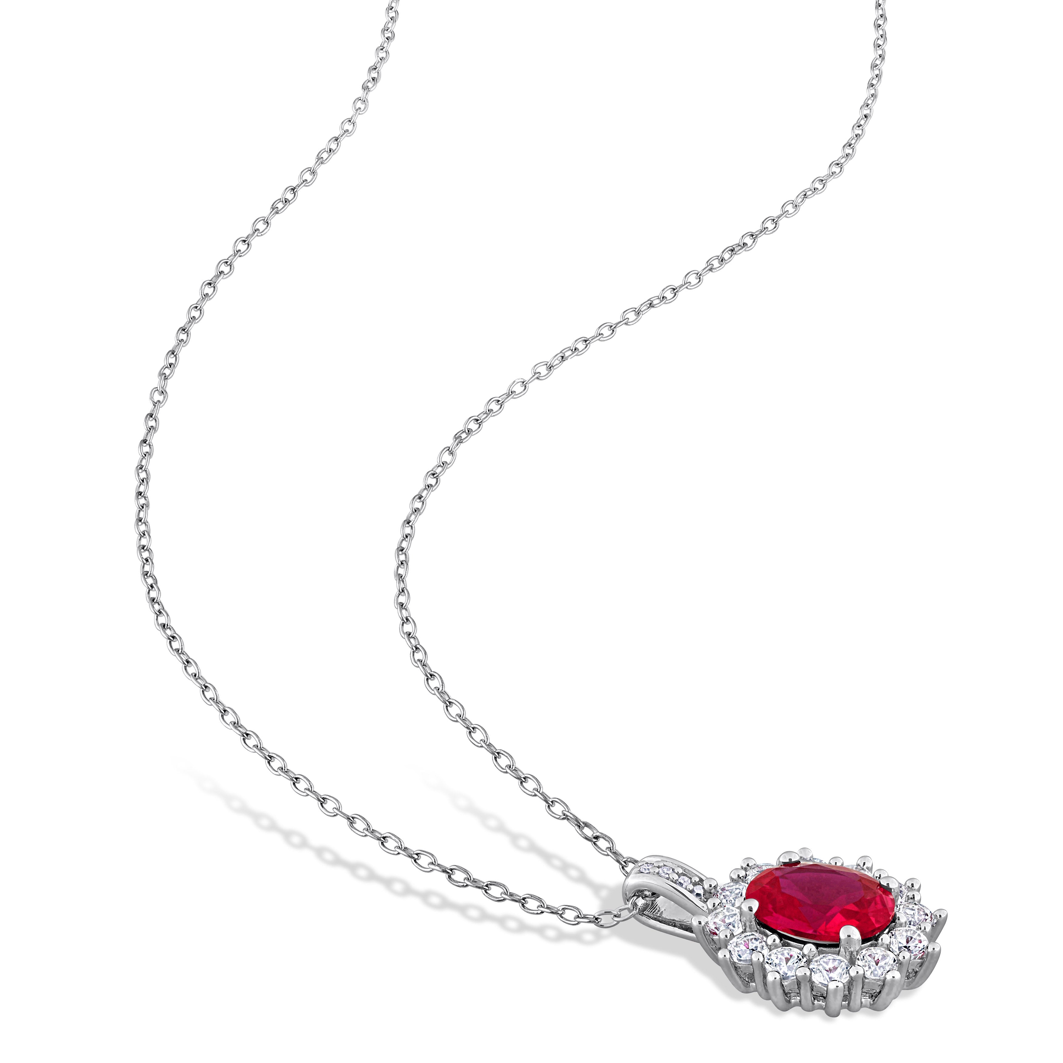 Red ruby halo pendant necklace detail showing oval gemstone and white sapphire halo by Delmar