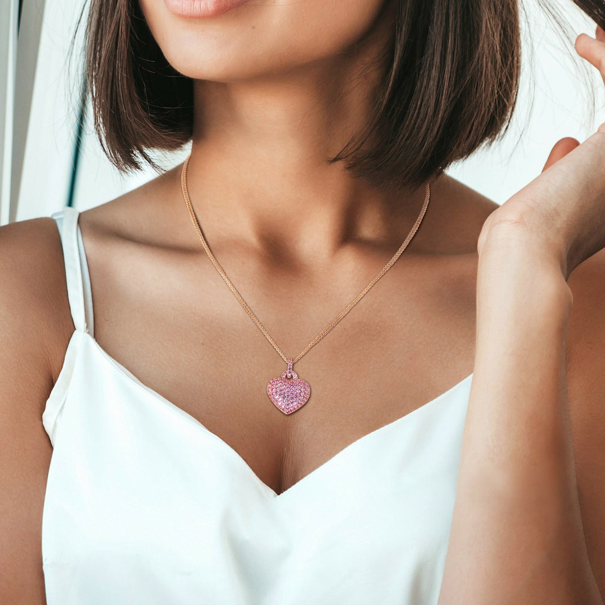 Rose-plated sterling silver heart pendant necklace worn, lifestyle view by Lord & Taylor