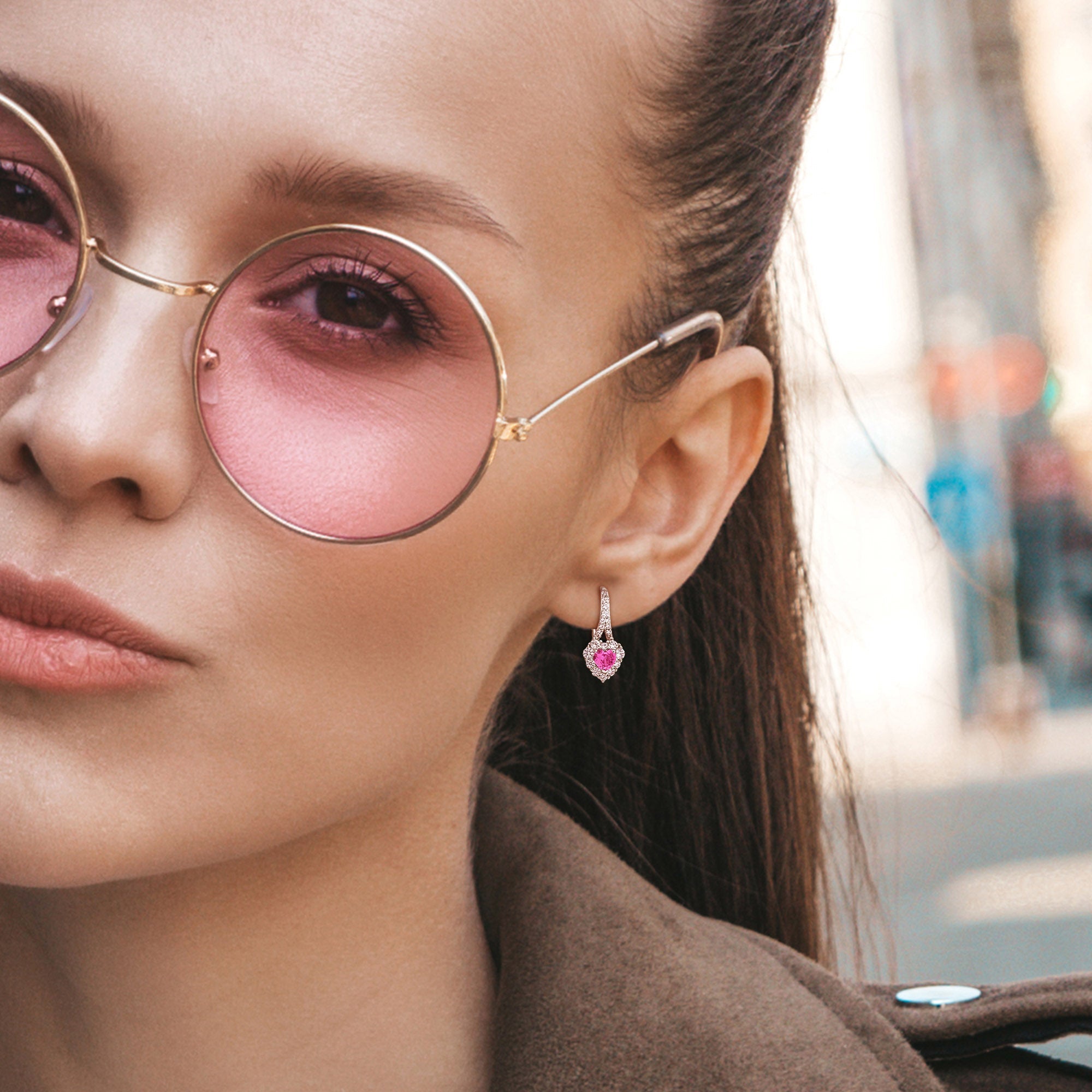 Pink sapphire heart halo earrings worn, lifestyle view by Lord & Taylor