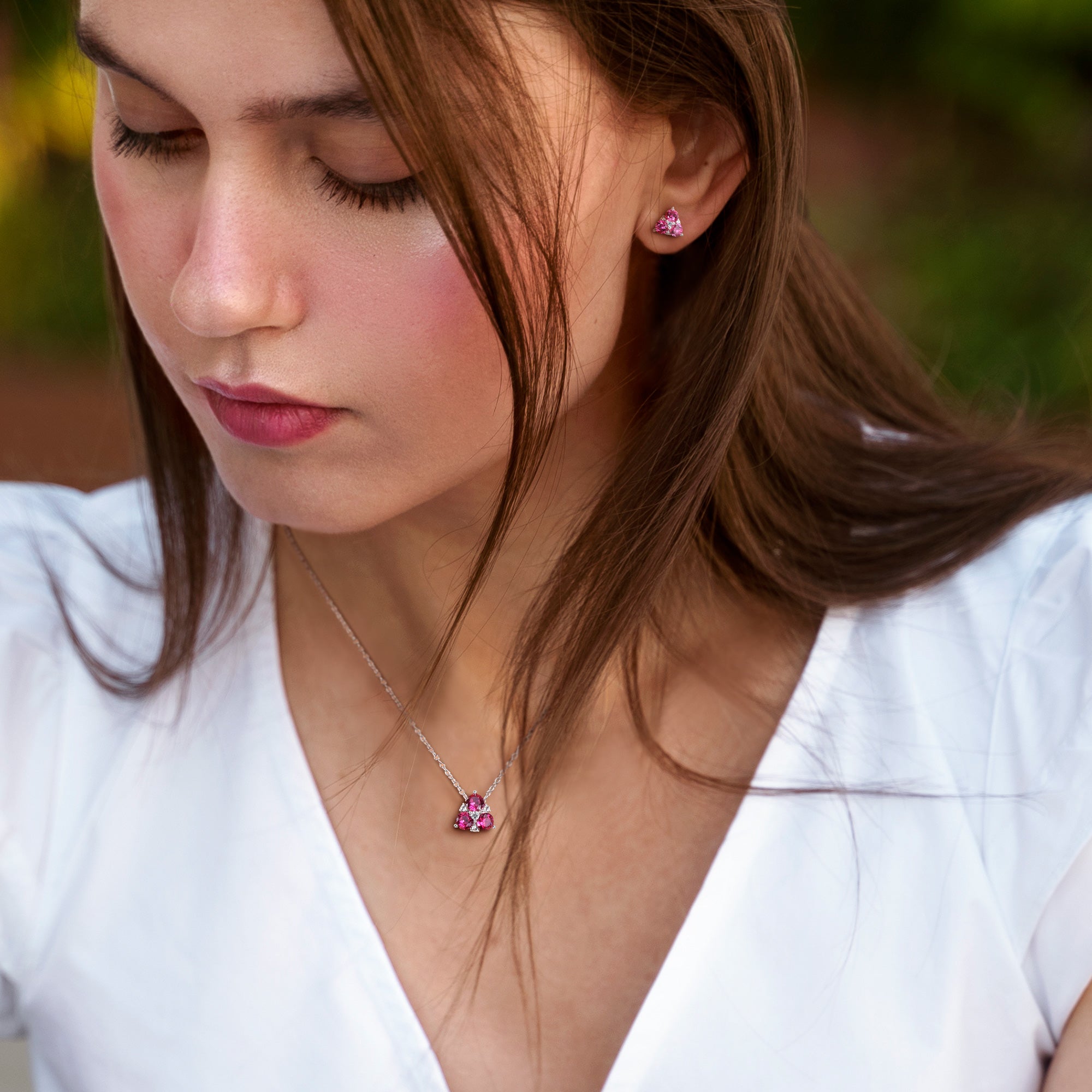Ruby gemstone necklace and earring set worn, lifestyle view by Lord & Taylor