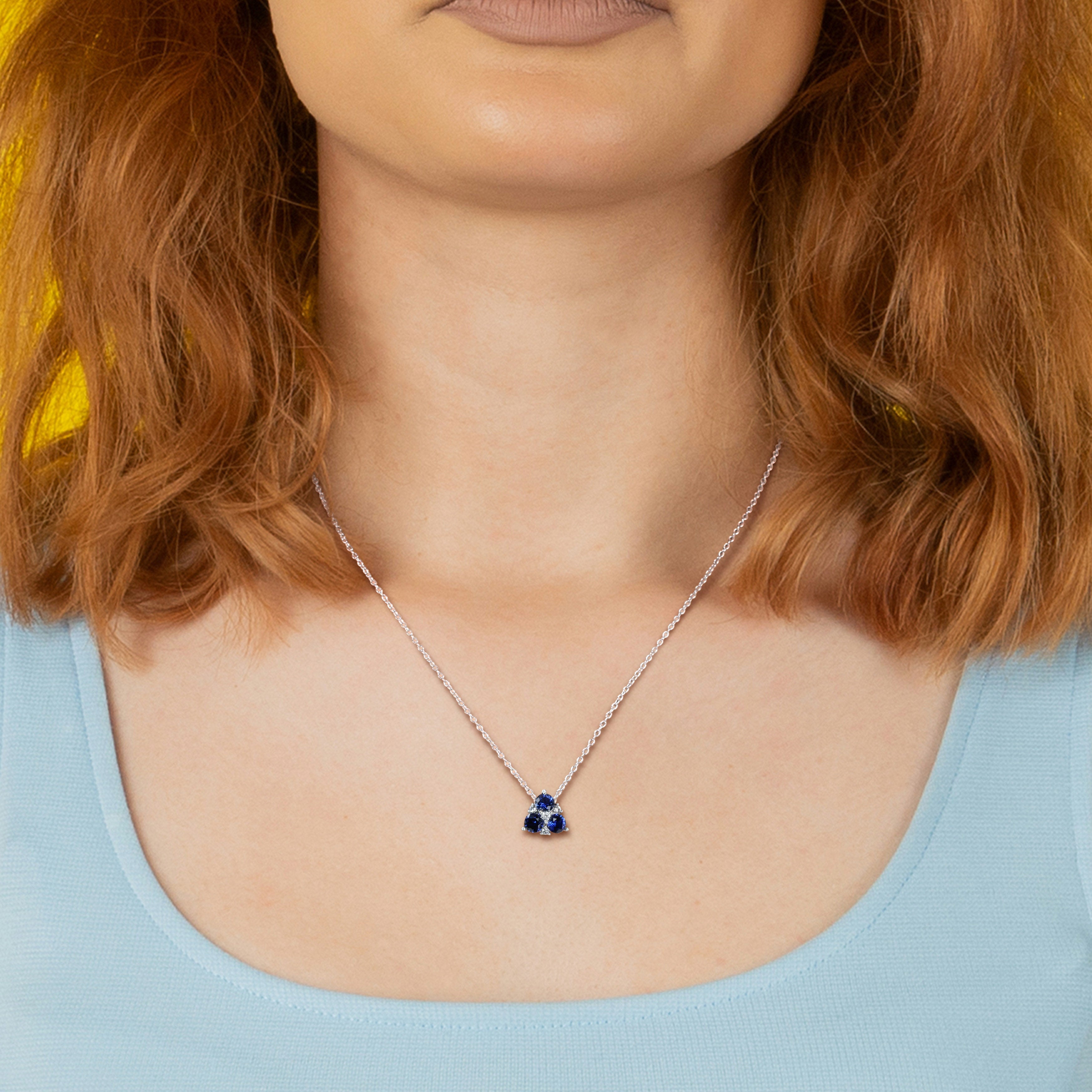Blue sapphire necklace and earring set worn, lifestyle view by Lord & Taylor