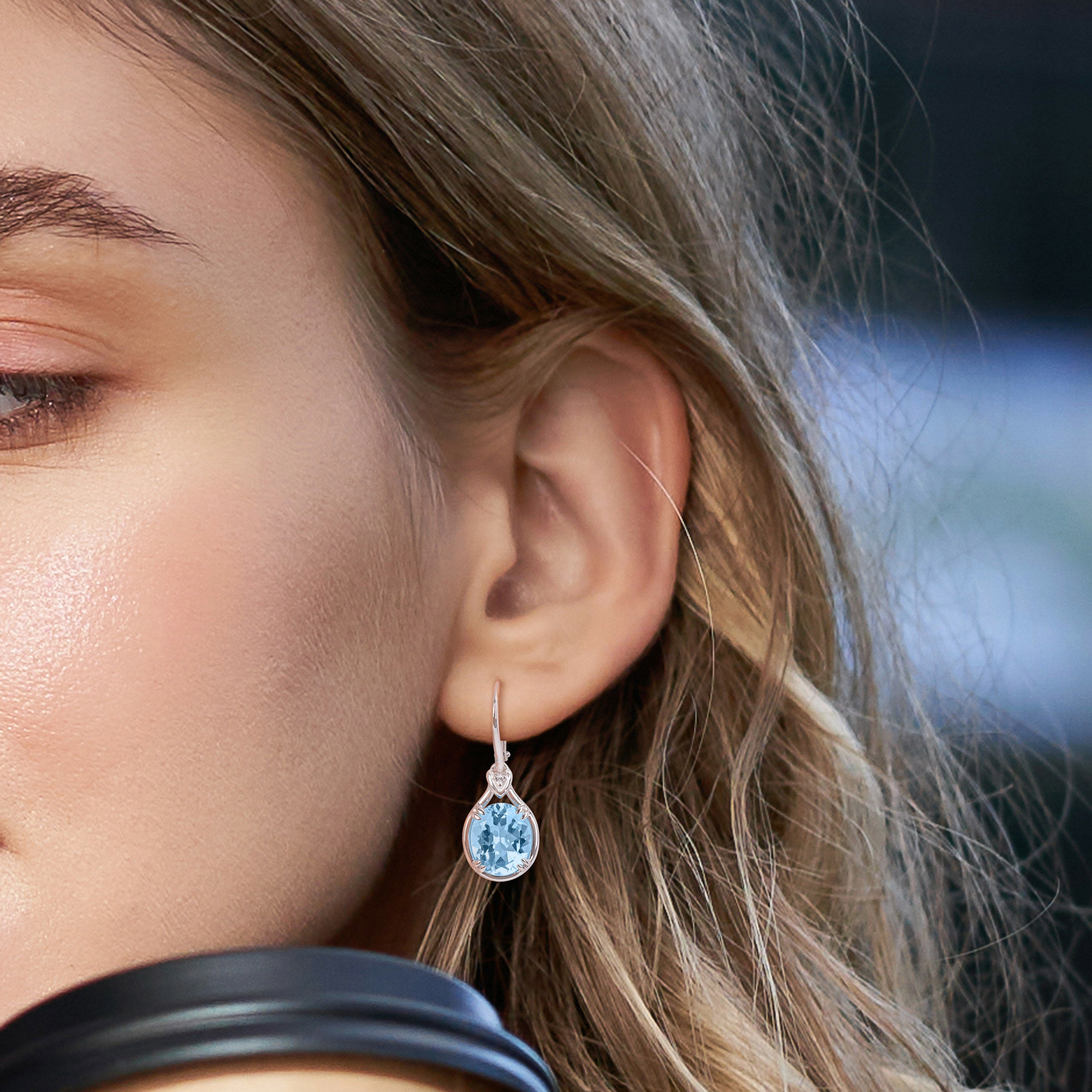 Blue topaz sterling silver drop earrings worn, lifestyle view by Lord & Taylor