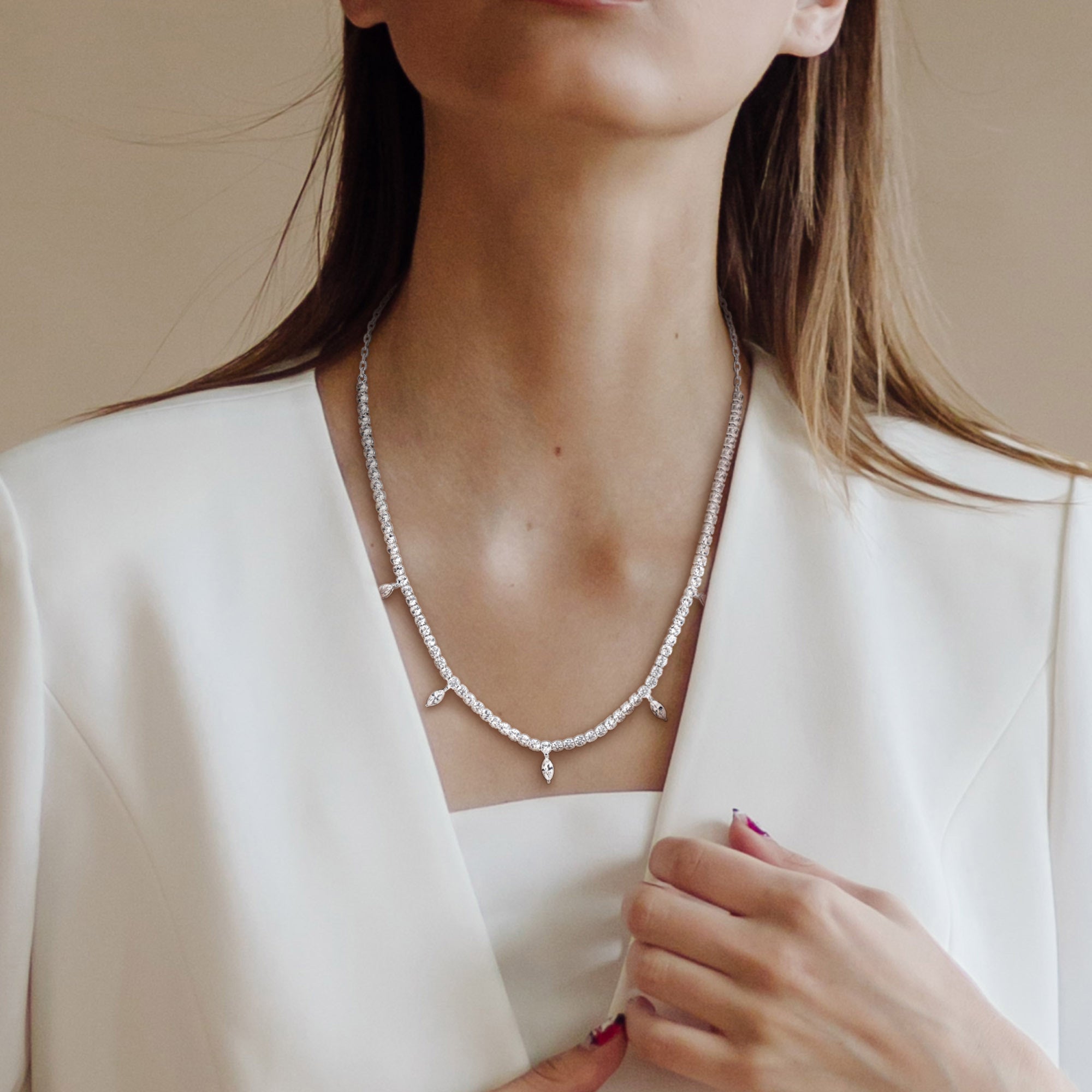 Sterling silver charm necklace with white sapphires worn, lifestyle view by Lord & Taylor