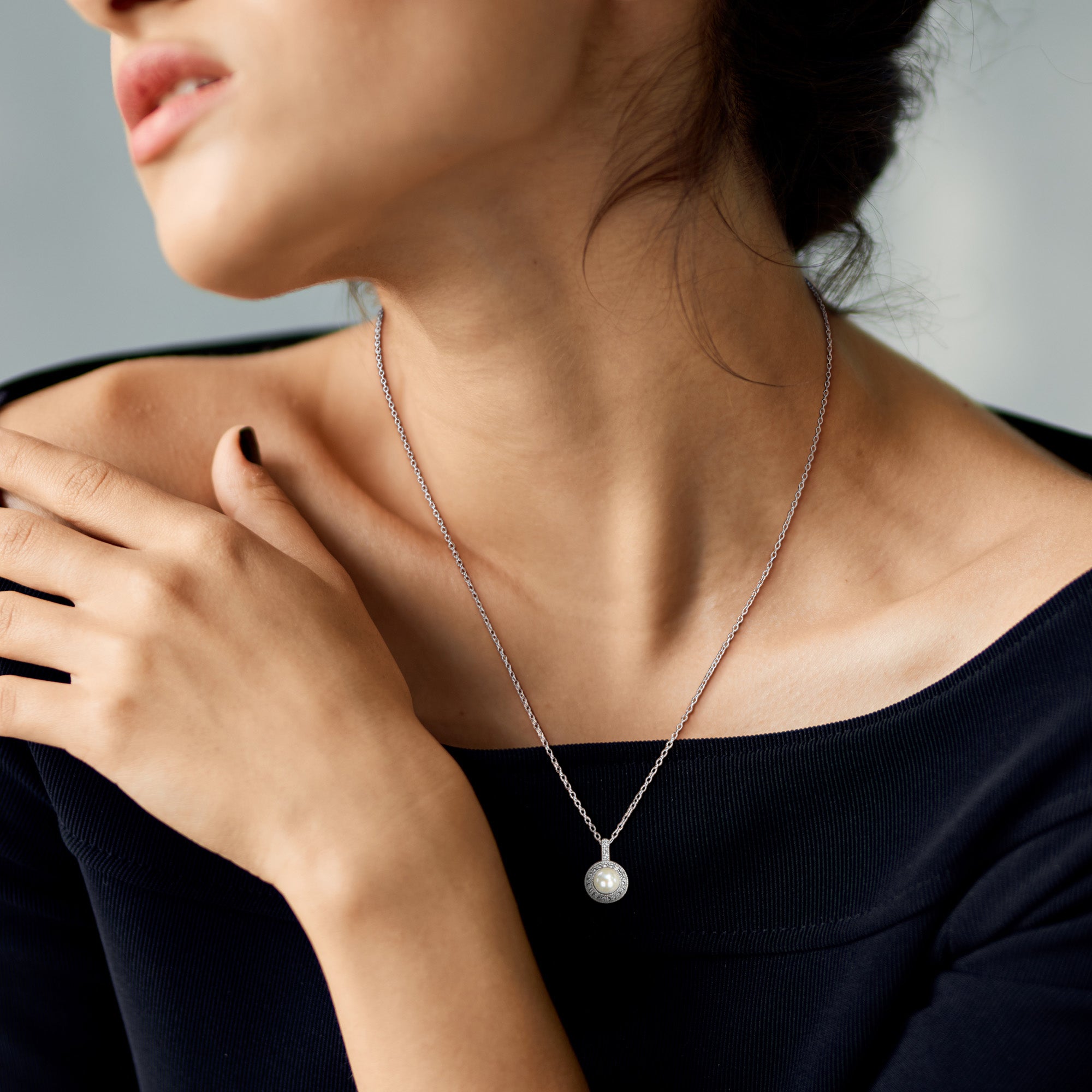 White pearl pendant necklace with topaz halo by Lord & Taylor, lifestyle view