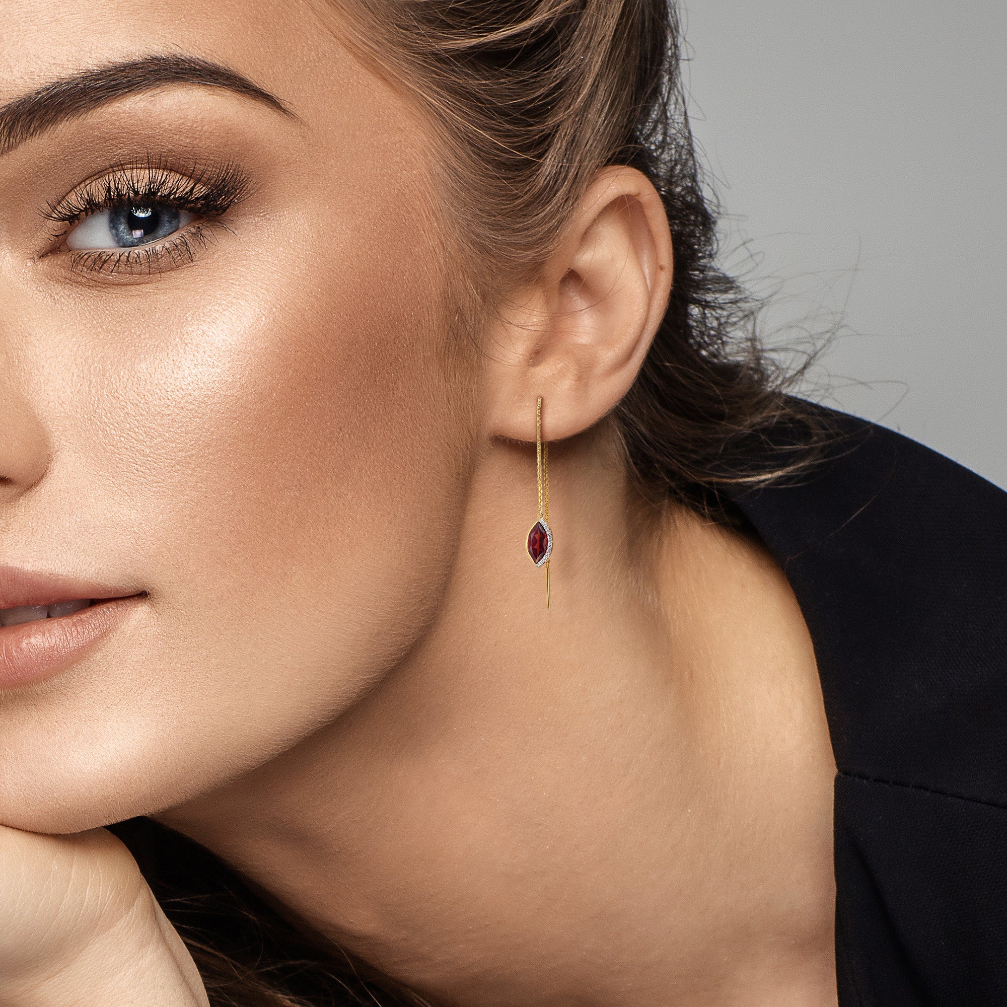 Garnet and diamond threader earrings worn, lifestyle view