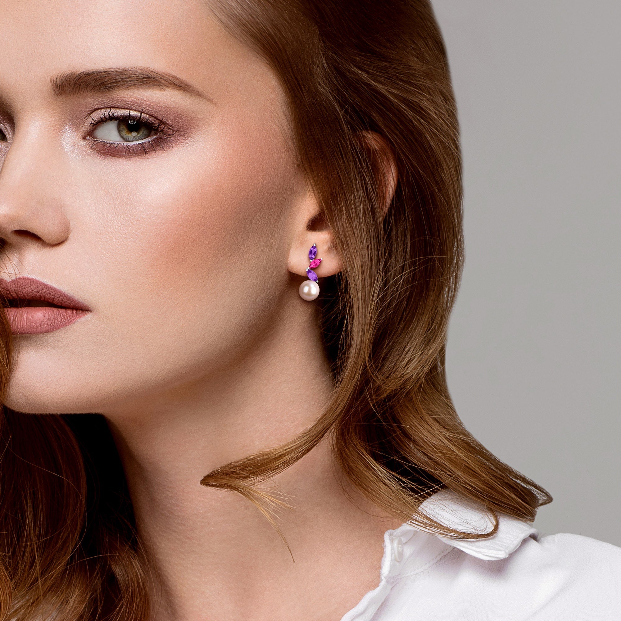 Pink pearl drop earrings with amethyst and topaz, lifestyle view