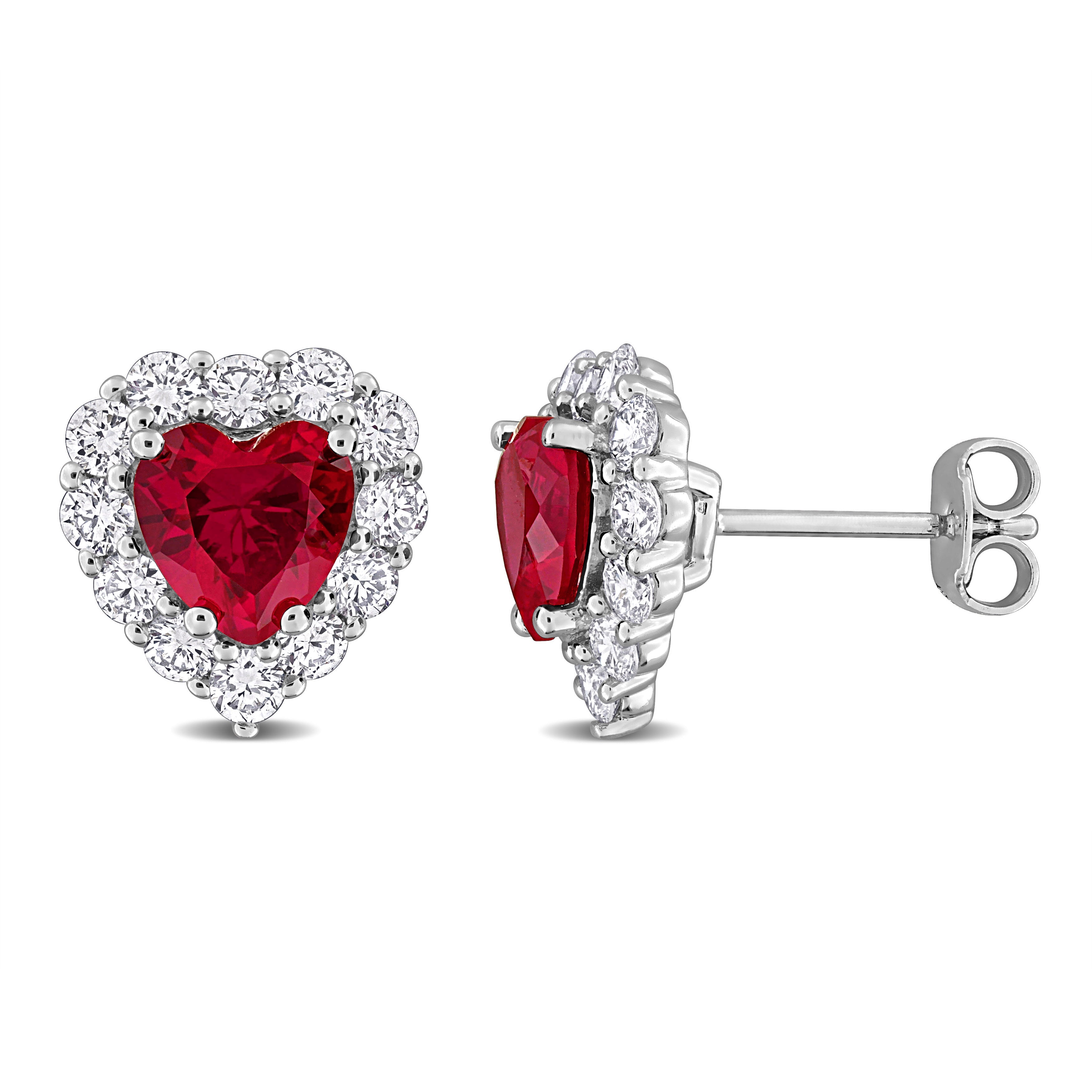 Red heart ruby stud earrings with diamond halo in sterling silver, front view by Lord & Taylor
