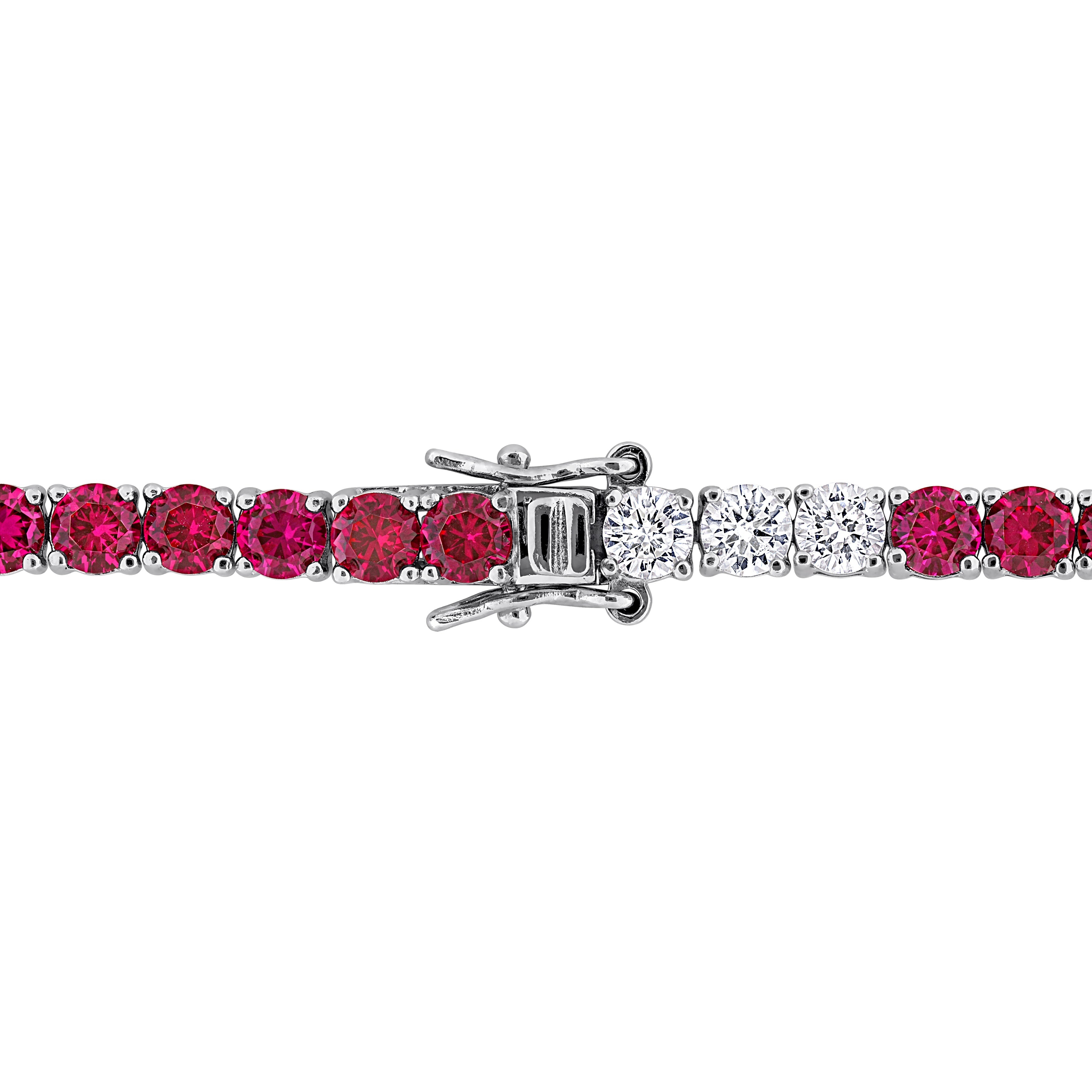 Sterling silver tennis bracelet with alternating ruby and sapphire stones, box clasp detail by Lord & Taylor