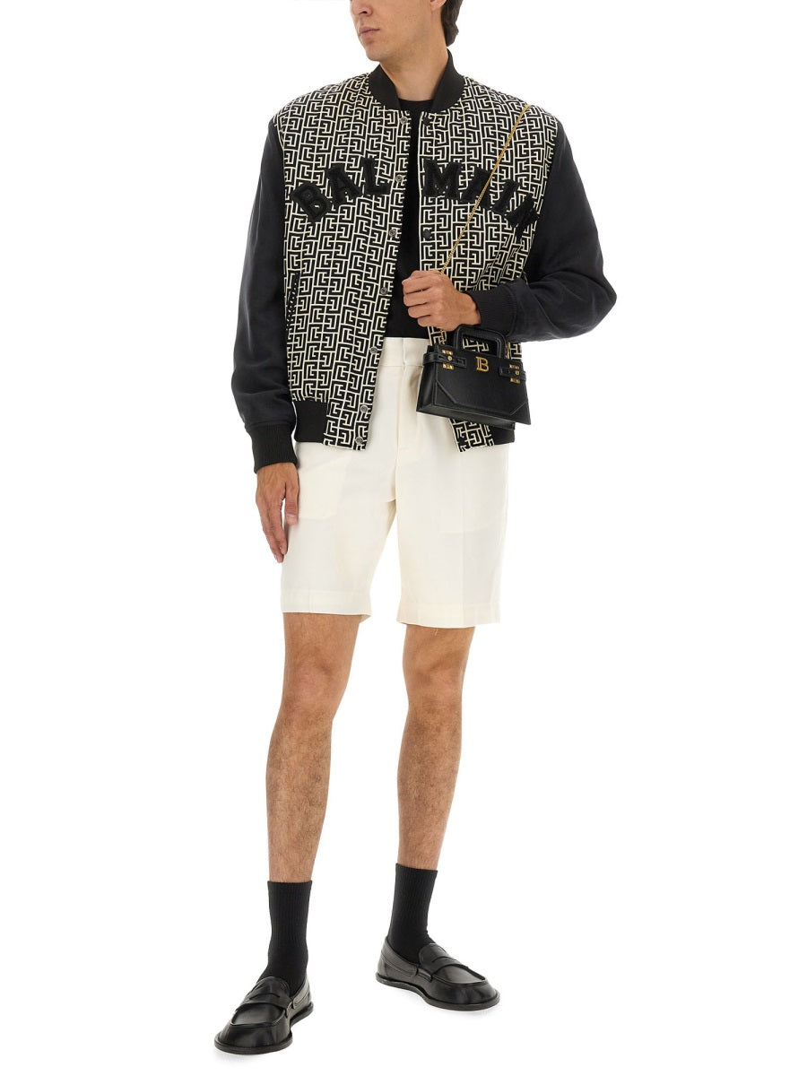 MONOGRAMMED VARSITY JACKET WITH PATCHES Balmain
