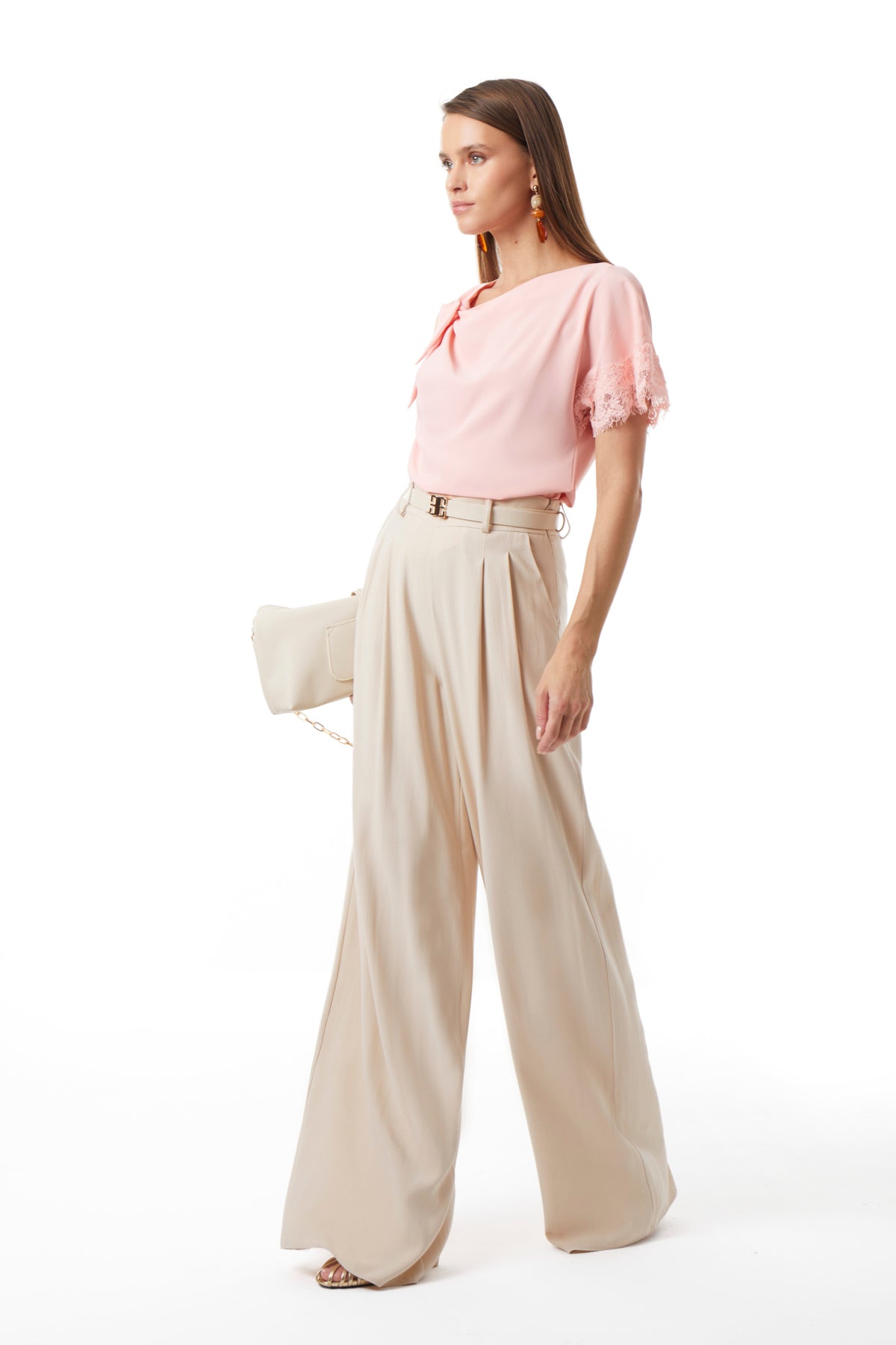 Beige wide-leg trousers side view showing high waist and ankle length