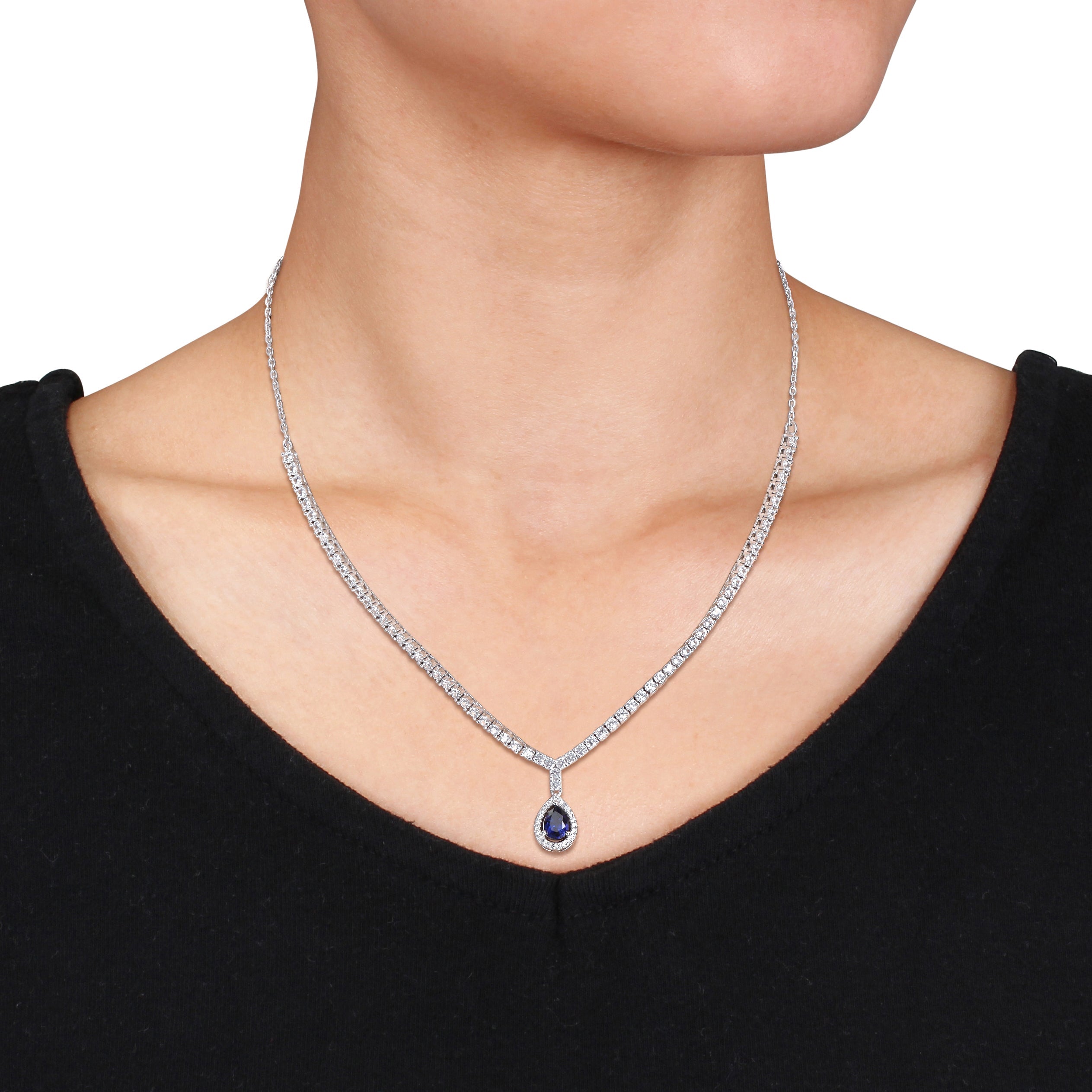 Lord & Taylor tennis necklace with created sapphire, close-up of pear-cut gemstone and halo setting