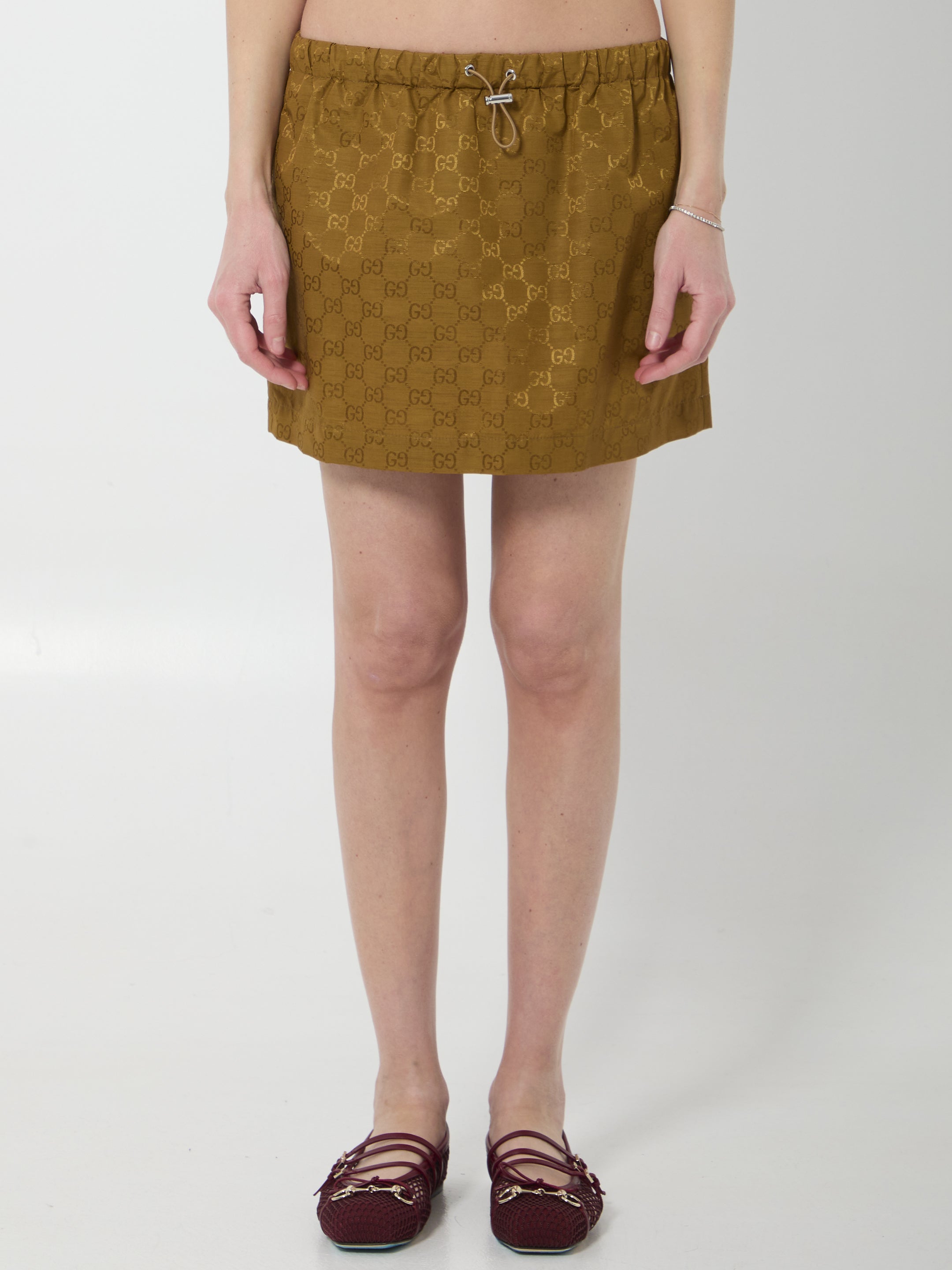 Caramel brown Gucci GG nylon mini skirt, front view