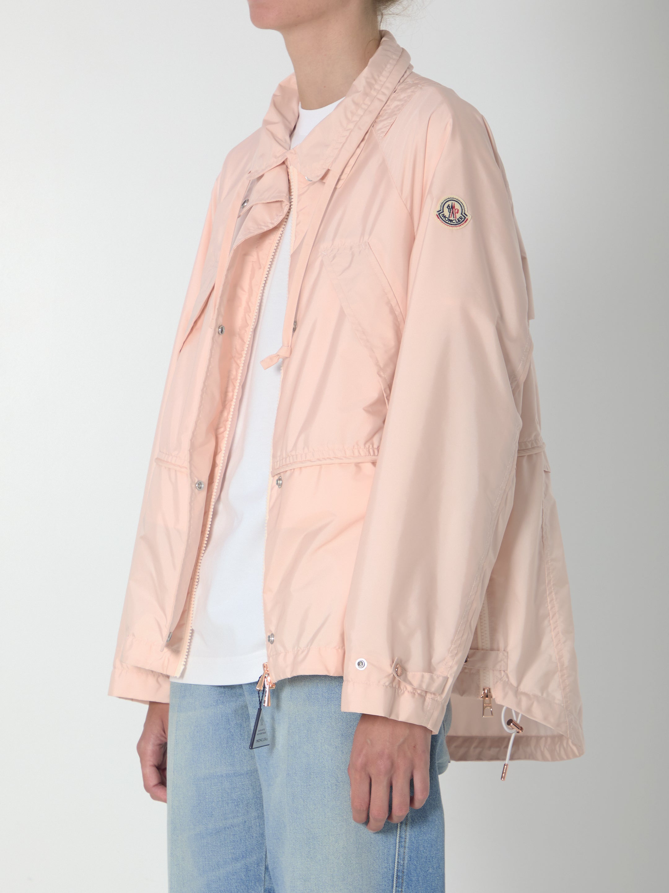 Light pink Moncler parka with adjustable drawstring collar, detail view