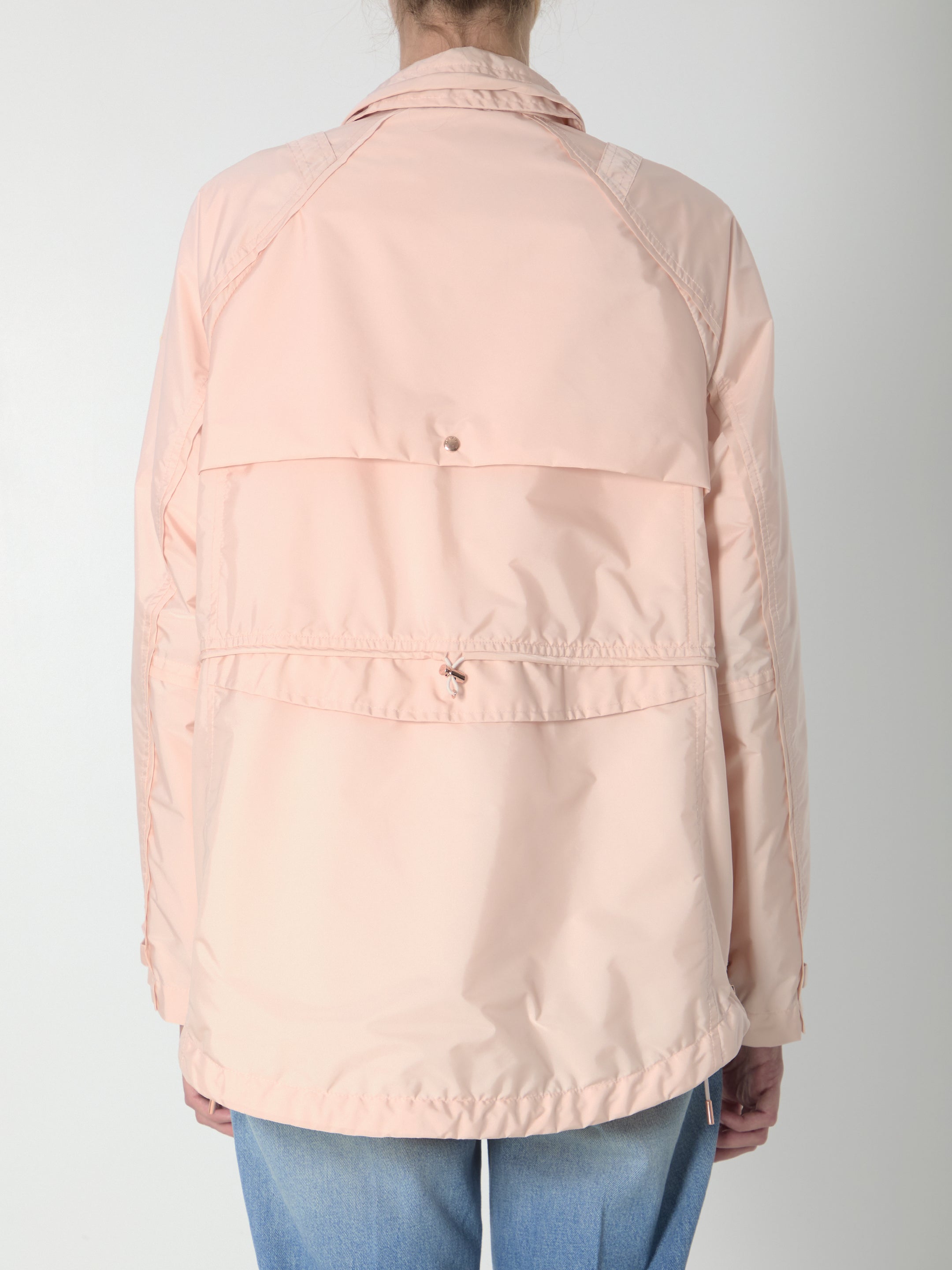 Light pink technical nylon parka by Moncler, back view with buttoned flap