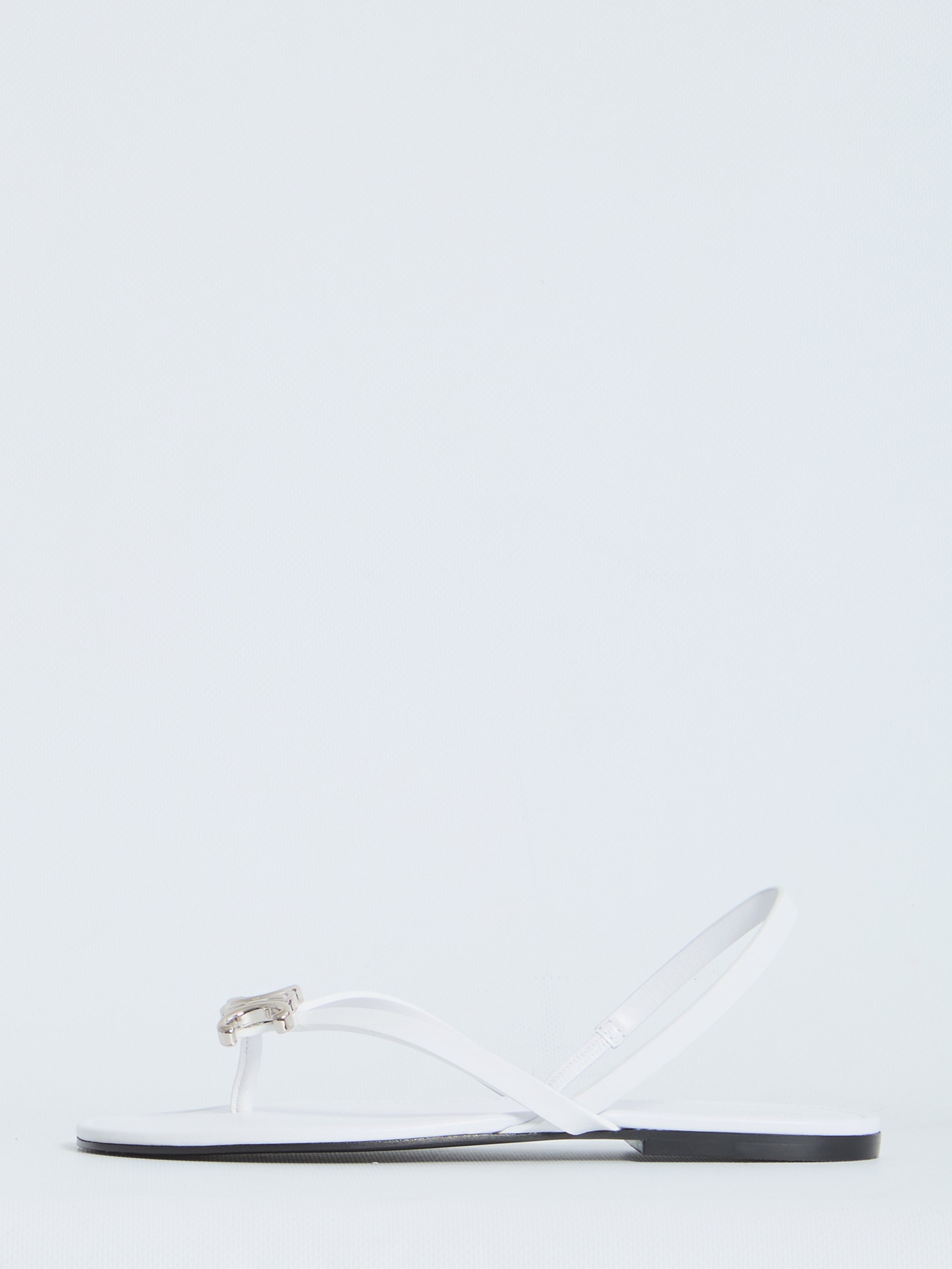 White Celine slider sandals with almond toe and TPU Triomphe detail, top view