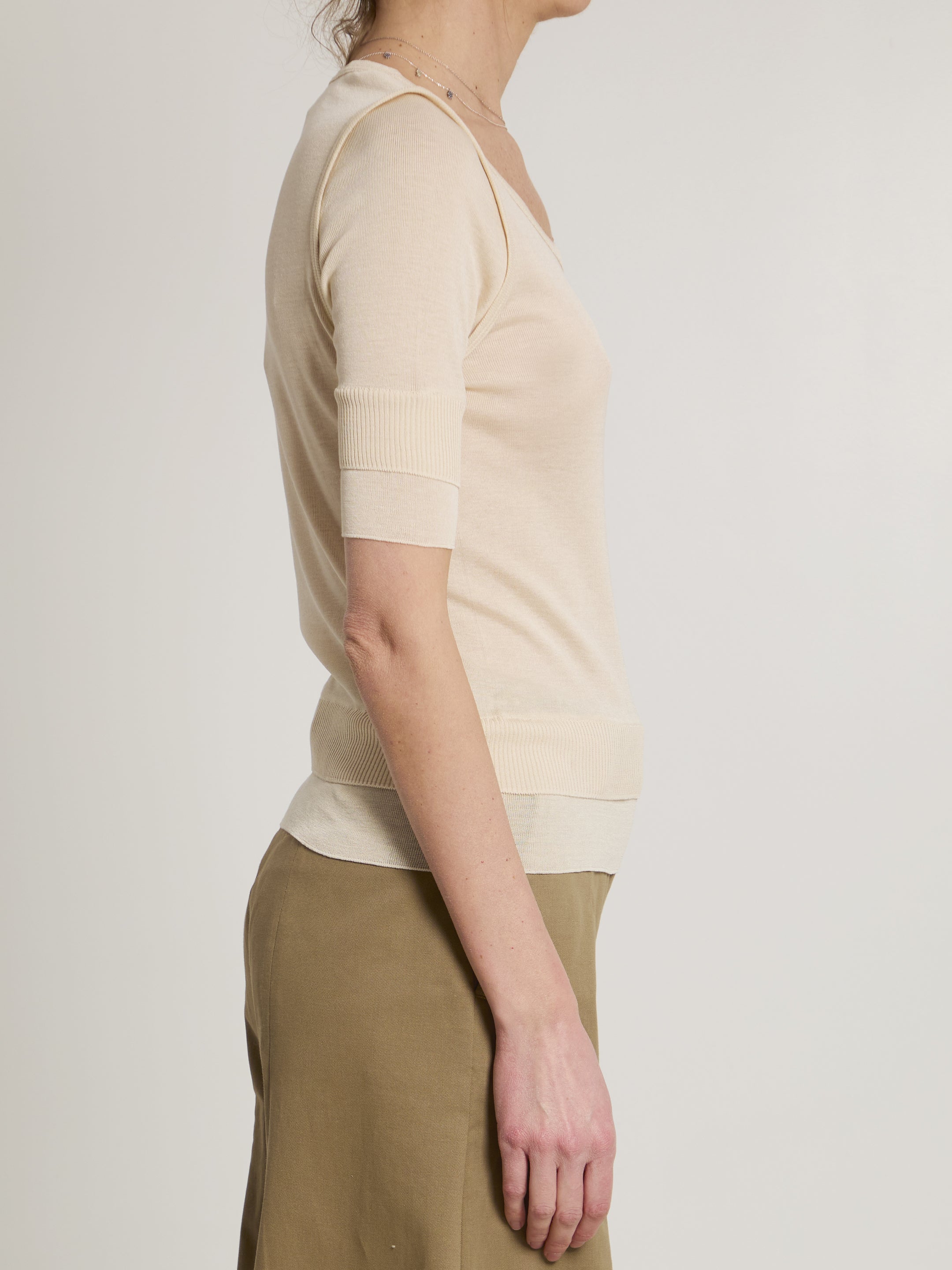 Pink Lemaire seamless top showing double sleeve detail, side view