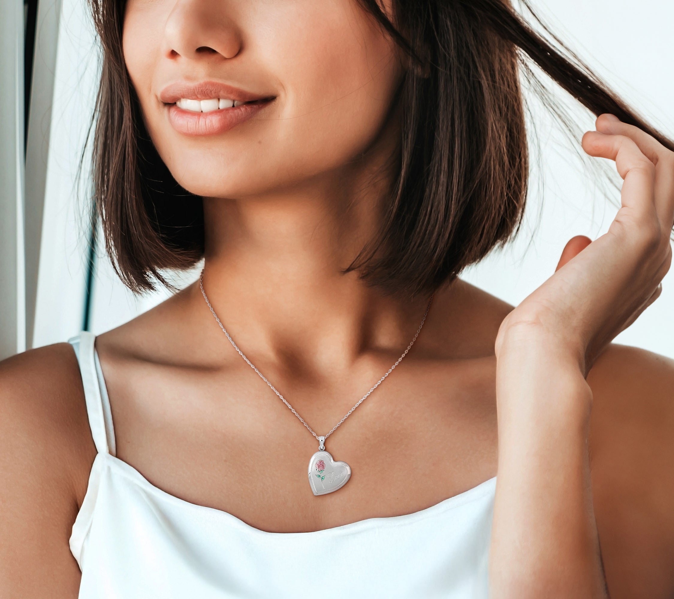 Sterling silver heart locket necklace worn, lifestyle view
