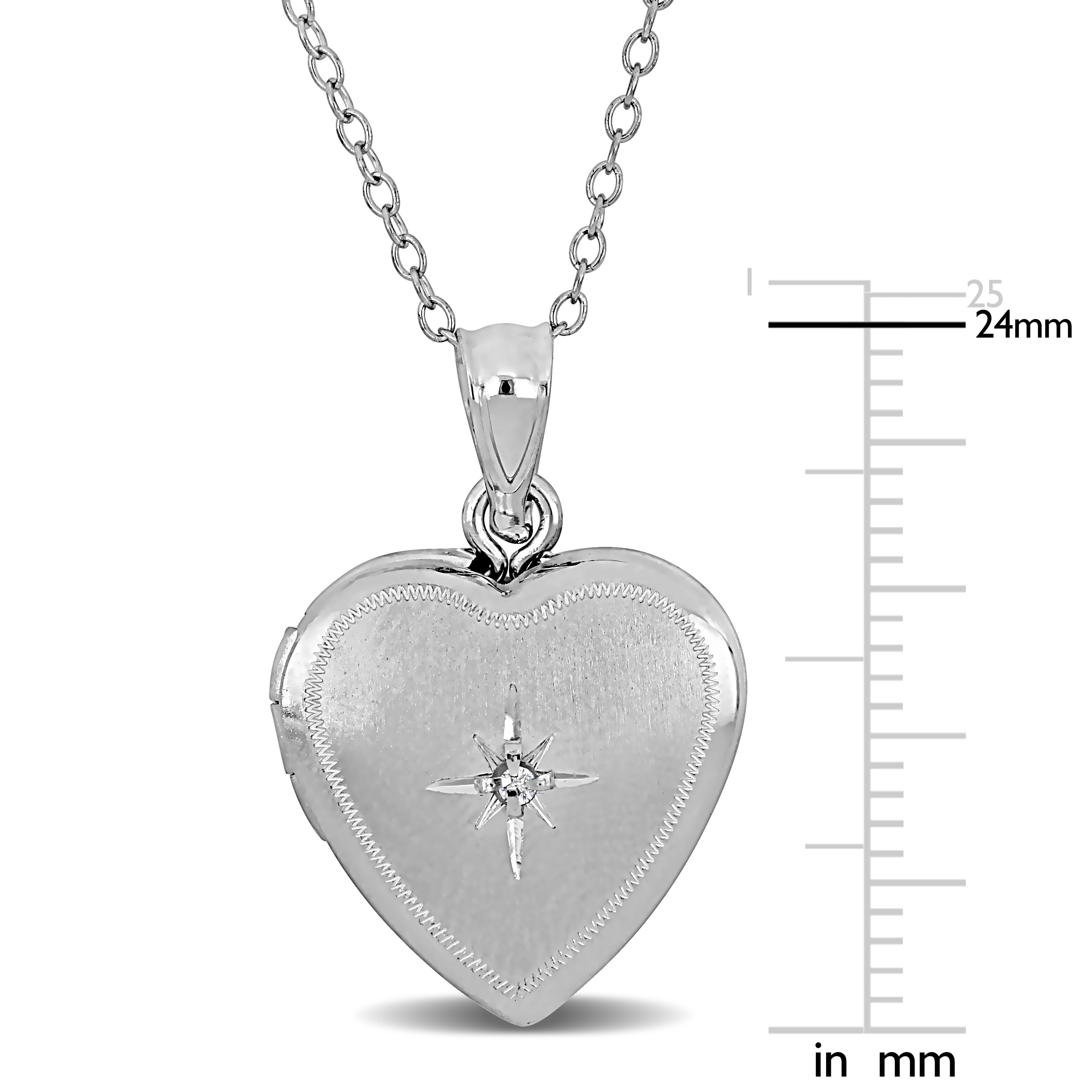 Sterling silver heart locket close-up showing cubic zirconia star detail by Lord & Taylor