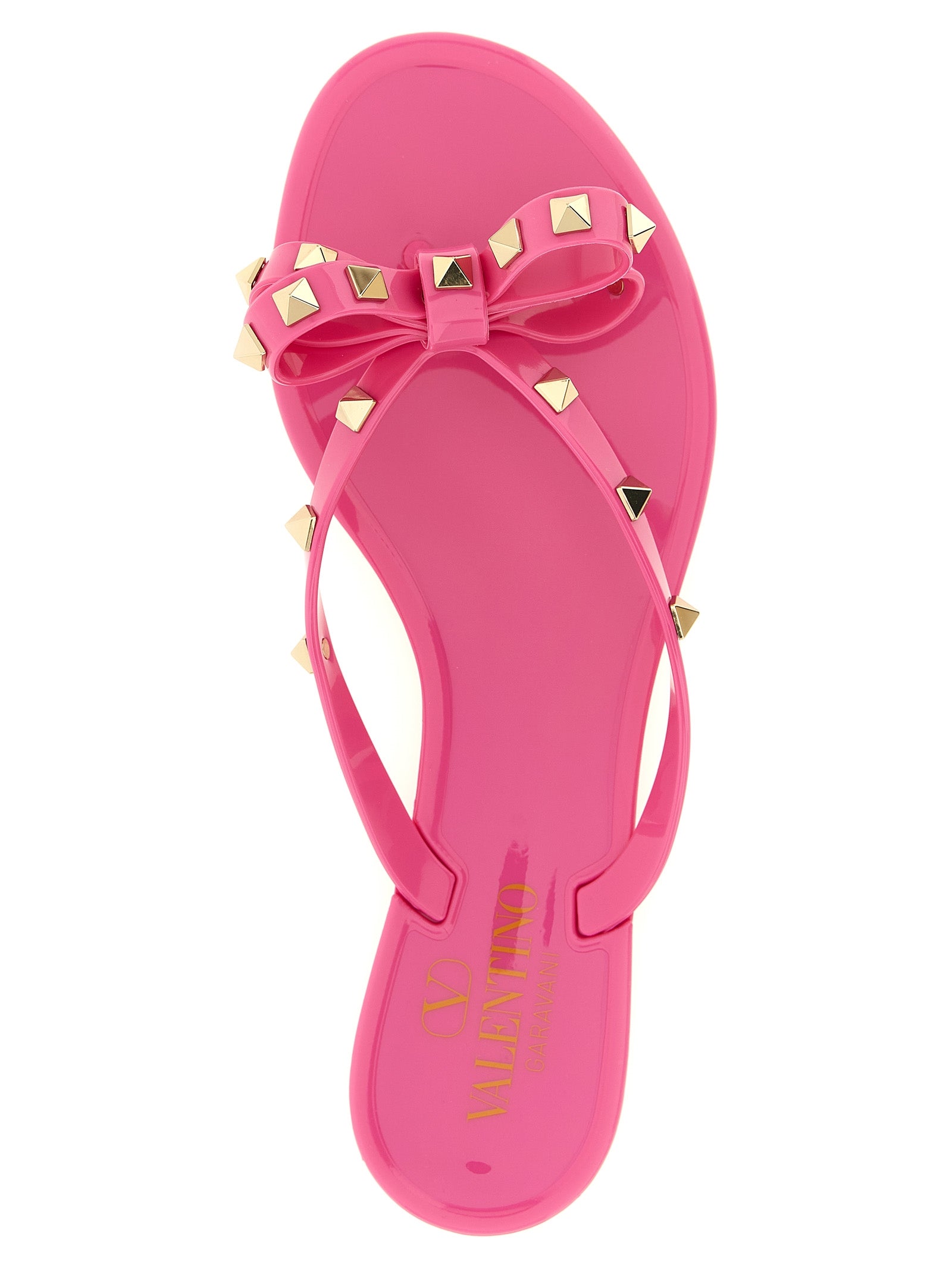 Fuchsia Rockstud flip flop sandals by Valentino Garavani, sole view