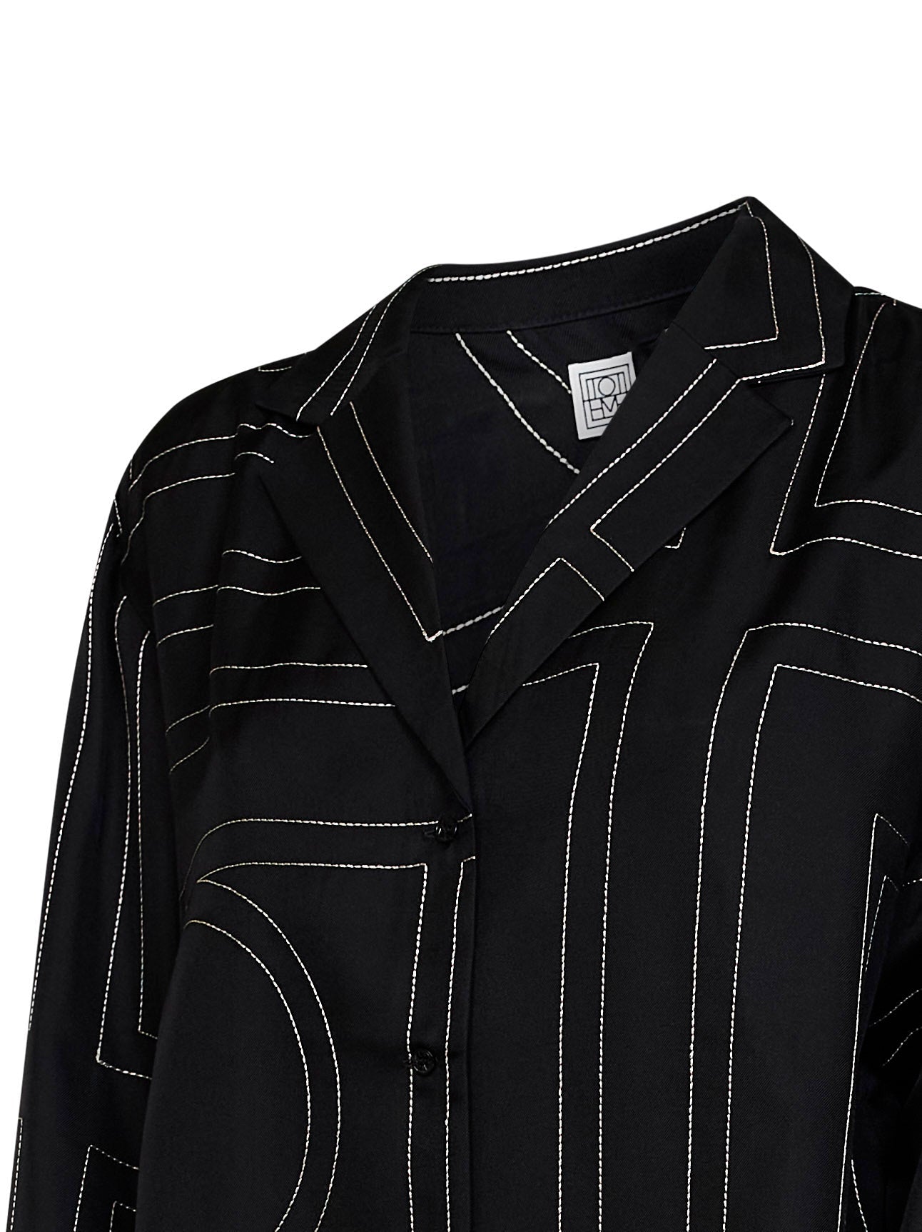 Black TOTEME silk pajama shirt with embroidered monogram pattern, back view